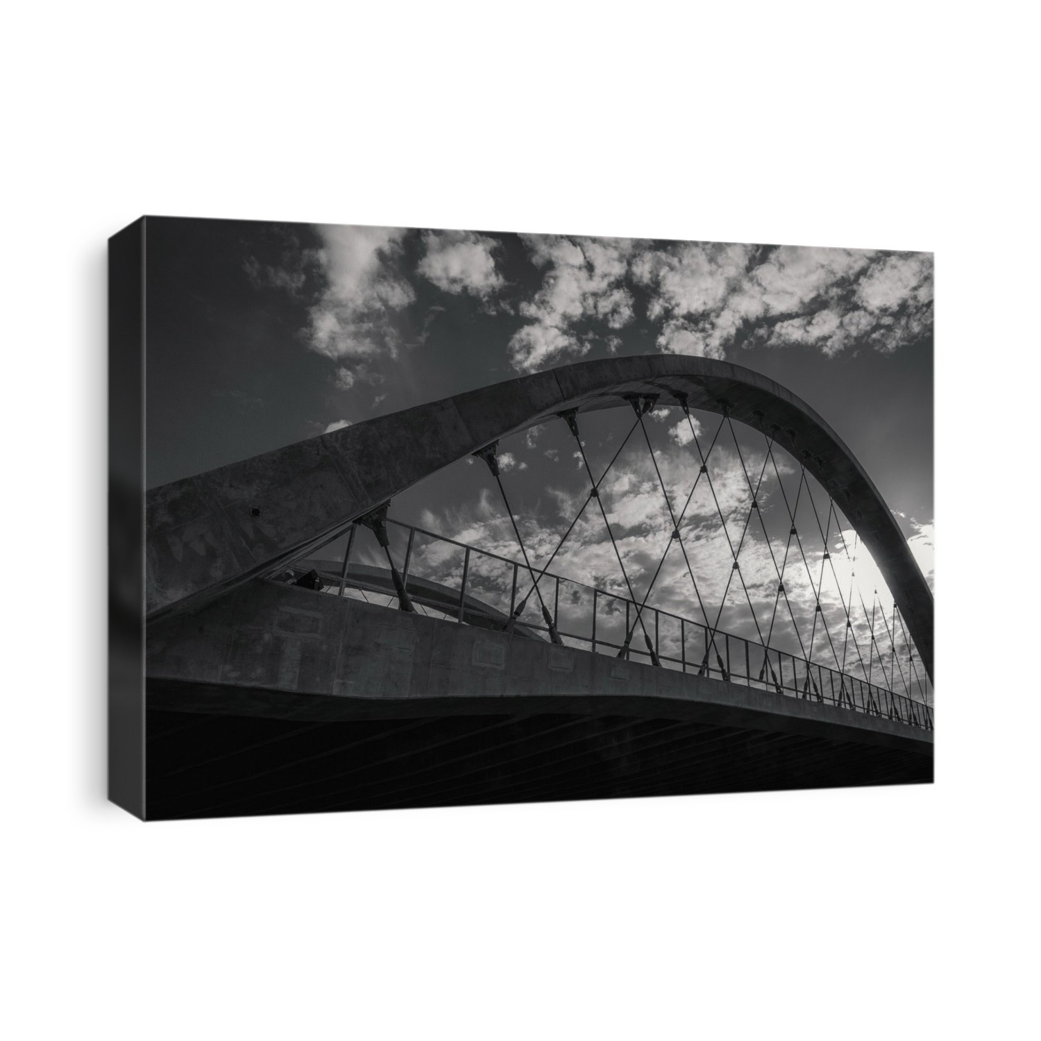 Black and white image of an arch support of the Sixth Street Bridge against a cloudy sky