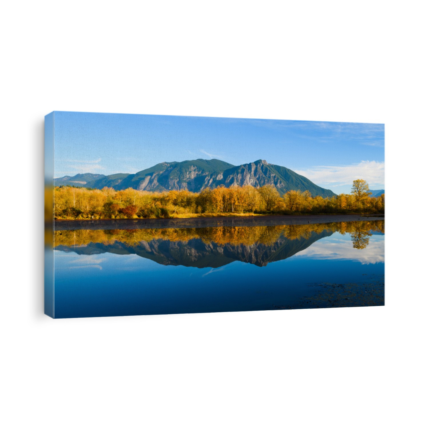Fall colors reflect in the calm water of Borst Lake also known as Snoqualmie Mill Pond from its role in the former lumber yard.  Mount Si rises on a sunny blue sky day