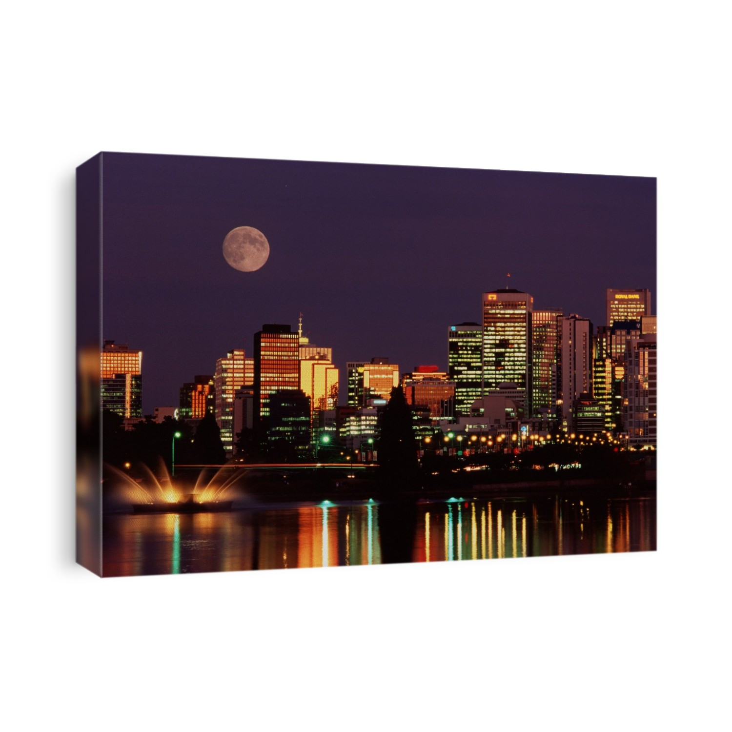 Moonrise over the city. An almost full moon seen rising over the skyline of Vancouver, Canada.