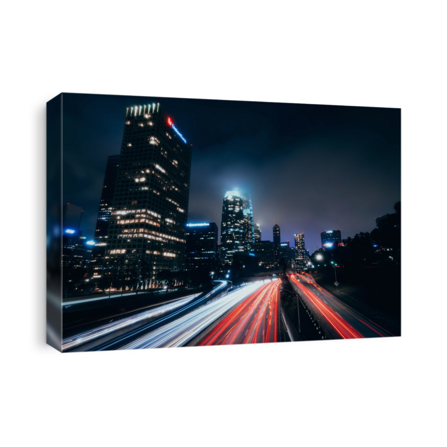 Long exposure of the LA Skyline at night from a pedestrian bridge
