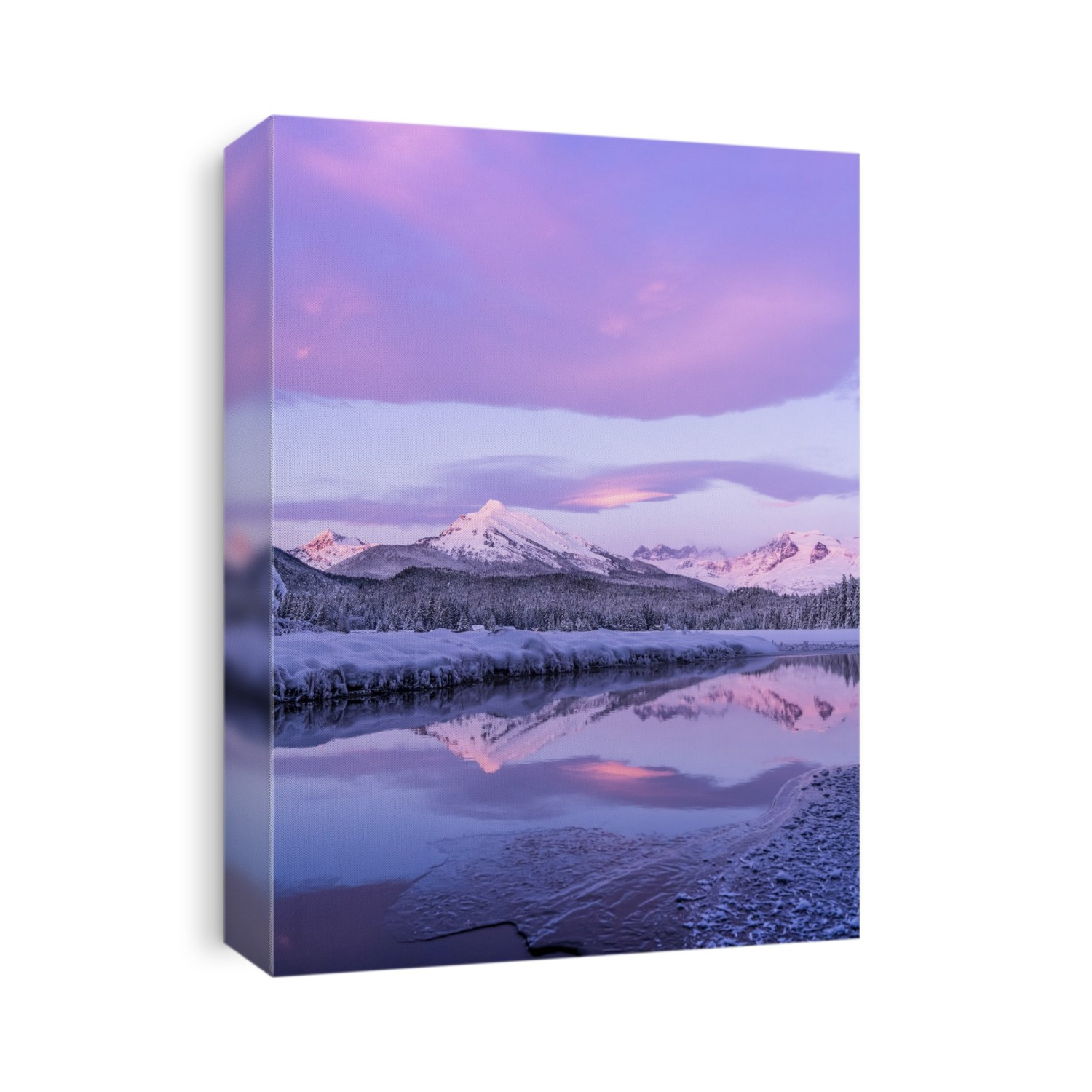 Alpenglow colours the snow-covered coastal range mountains, Mendenhall Glacier and Mendenhall towers are reflected in the open water along the edge of Auke Lake as the sun gets ready to set; Alaska, United States of America