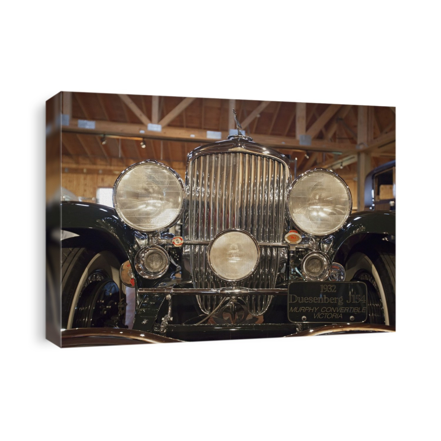 1932 Duesenberg Model J, in a barn at a car museum. This luxury automobile was made in Indianapolis by the US company Duesenberg from 1928 to 1937. Photographed at the Gilmore Car Museum, Hickory Corners, Michigan, USA.