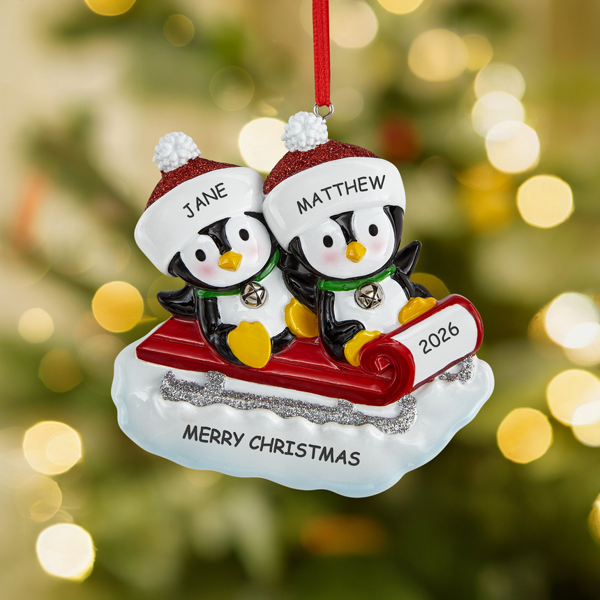Sledding Penguin Couple Ornament