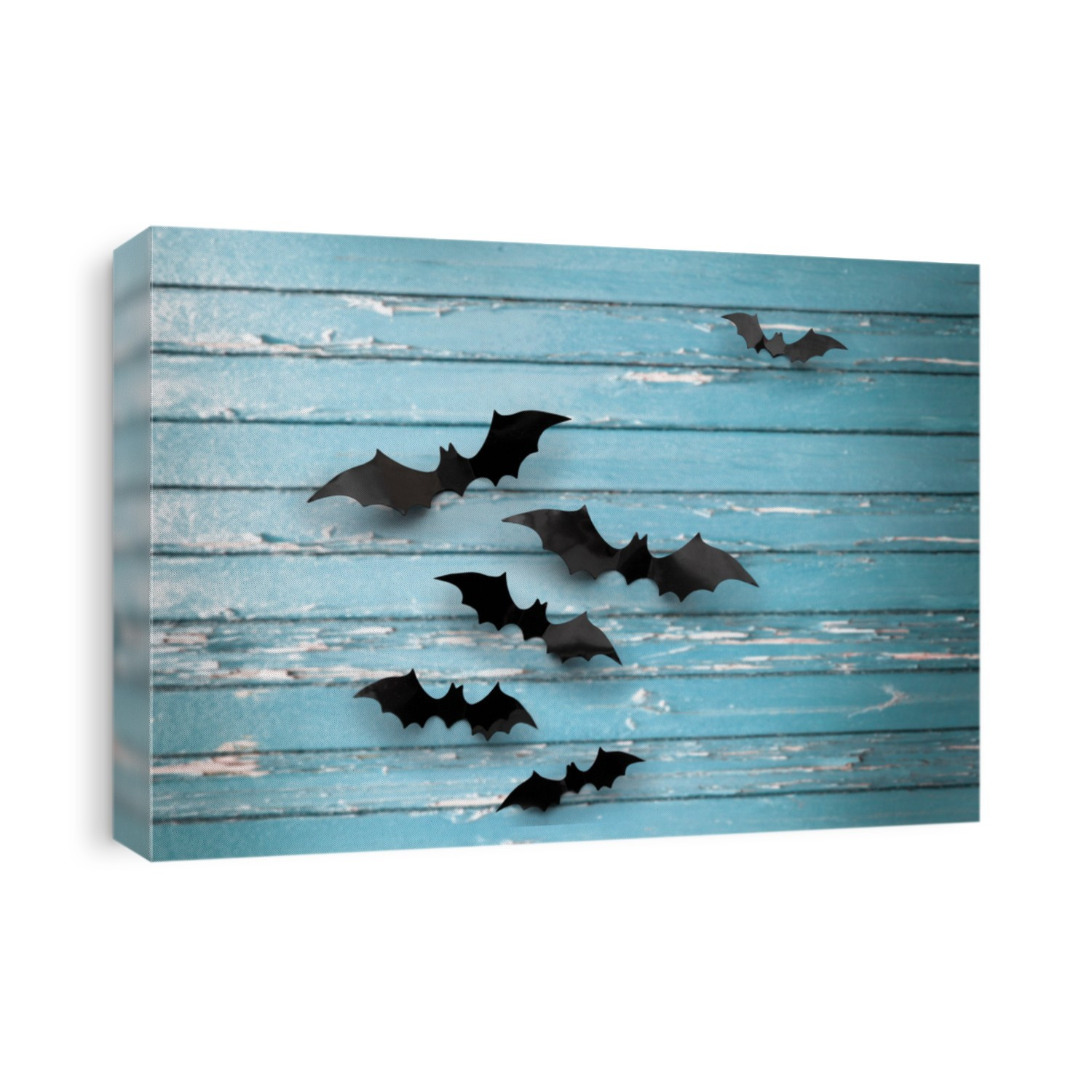 halloween, decoration and scary concept - black bats flying over blue shabby boards background