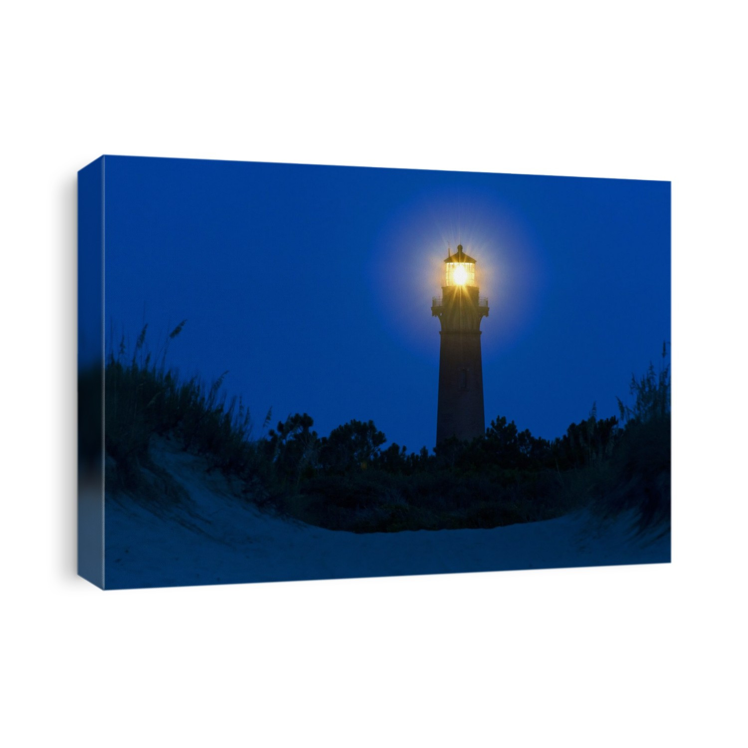 Currituck Beach Light. View of the Currituck Beach Light, Outer Banks, Corolla, North Carolina, USA, shining at night. This lighthouse was first lit in 1875. It was added to the US National Register of Historic Places in 1973.