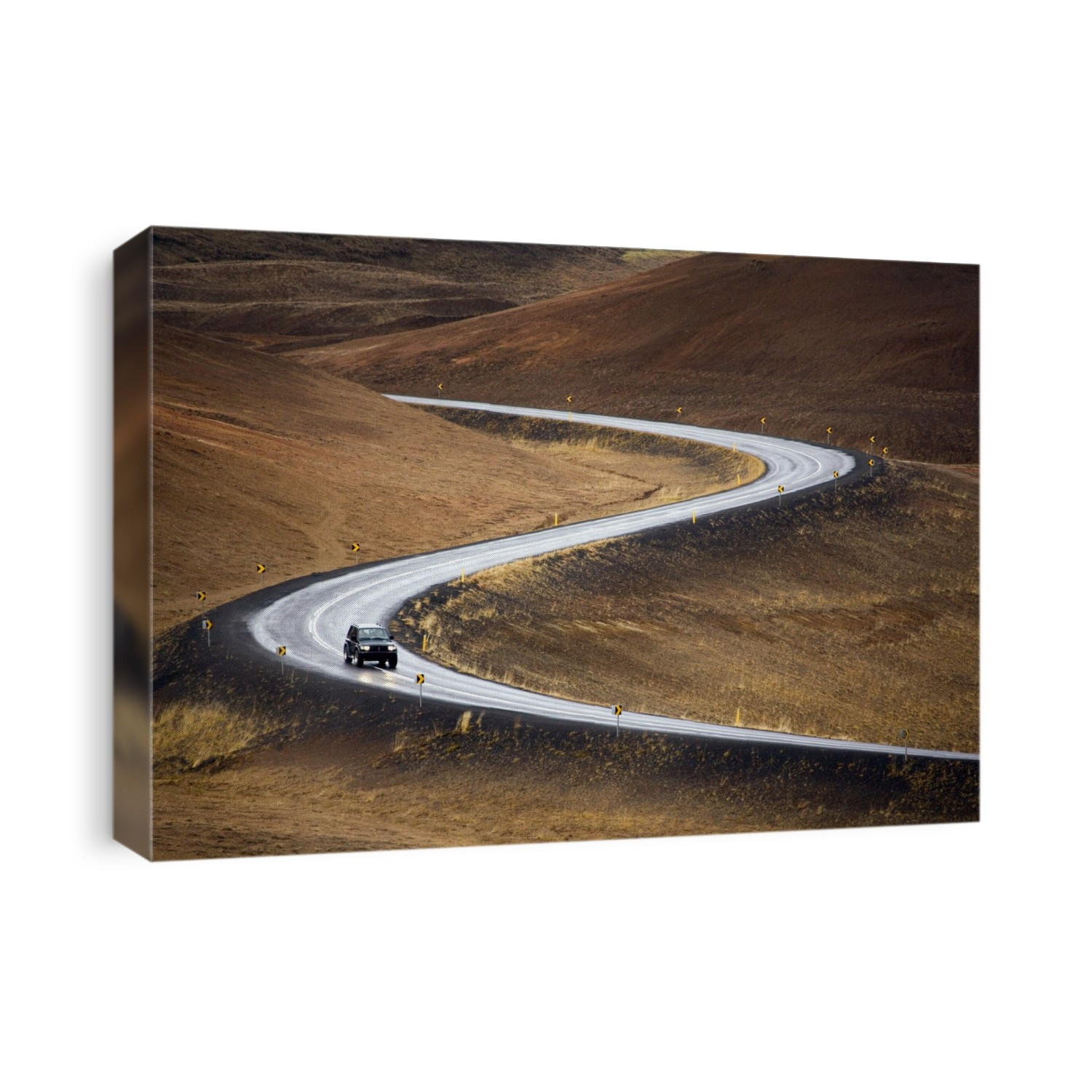 Winding road. Four-wheel drive SUV driving on a road with steep bends. Photographed in Iceland.