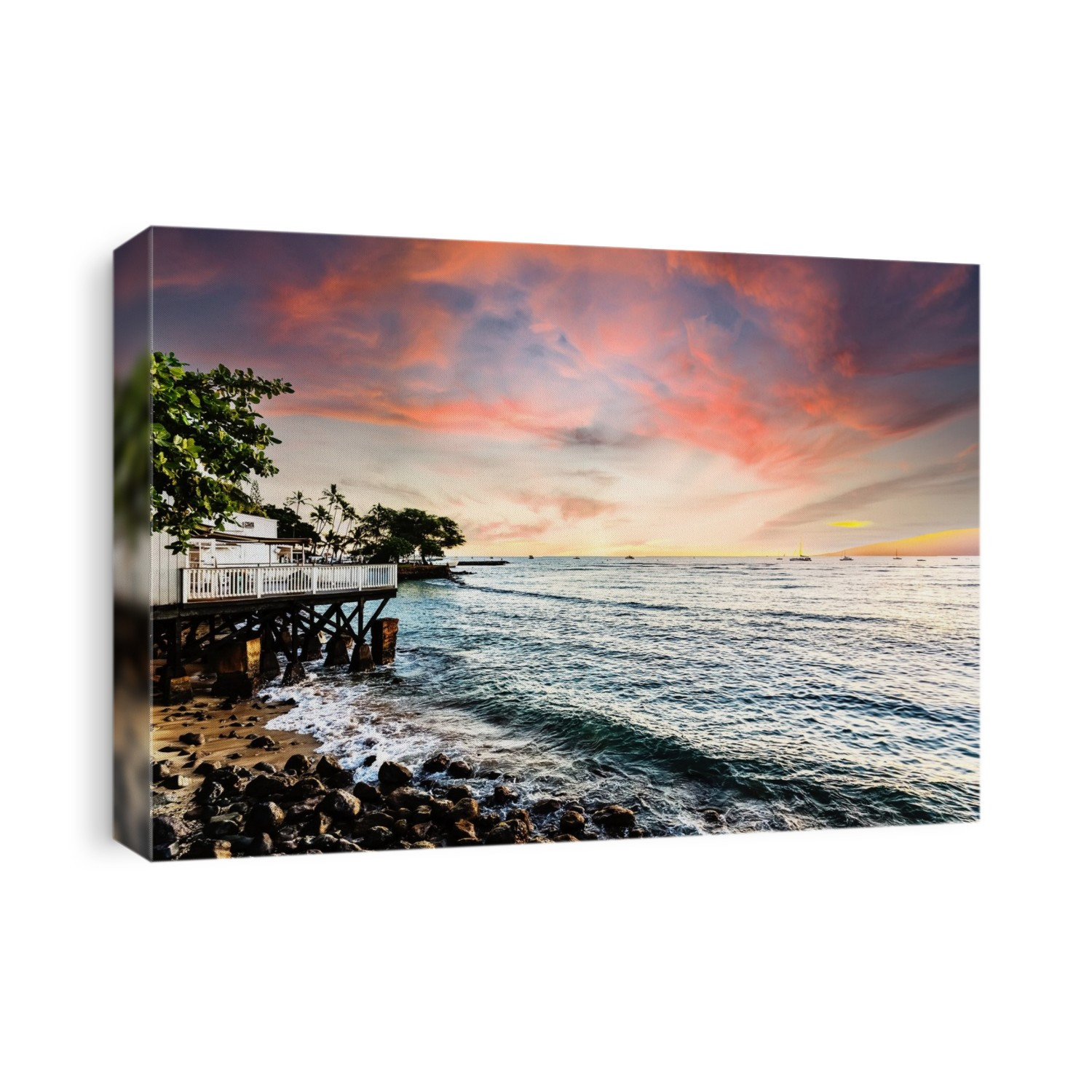 Numerous boats moored off shore in the water at sunset and a house on the waterfront in Lahaina; Lahaina, Maui, Hawaii, United States of America