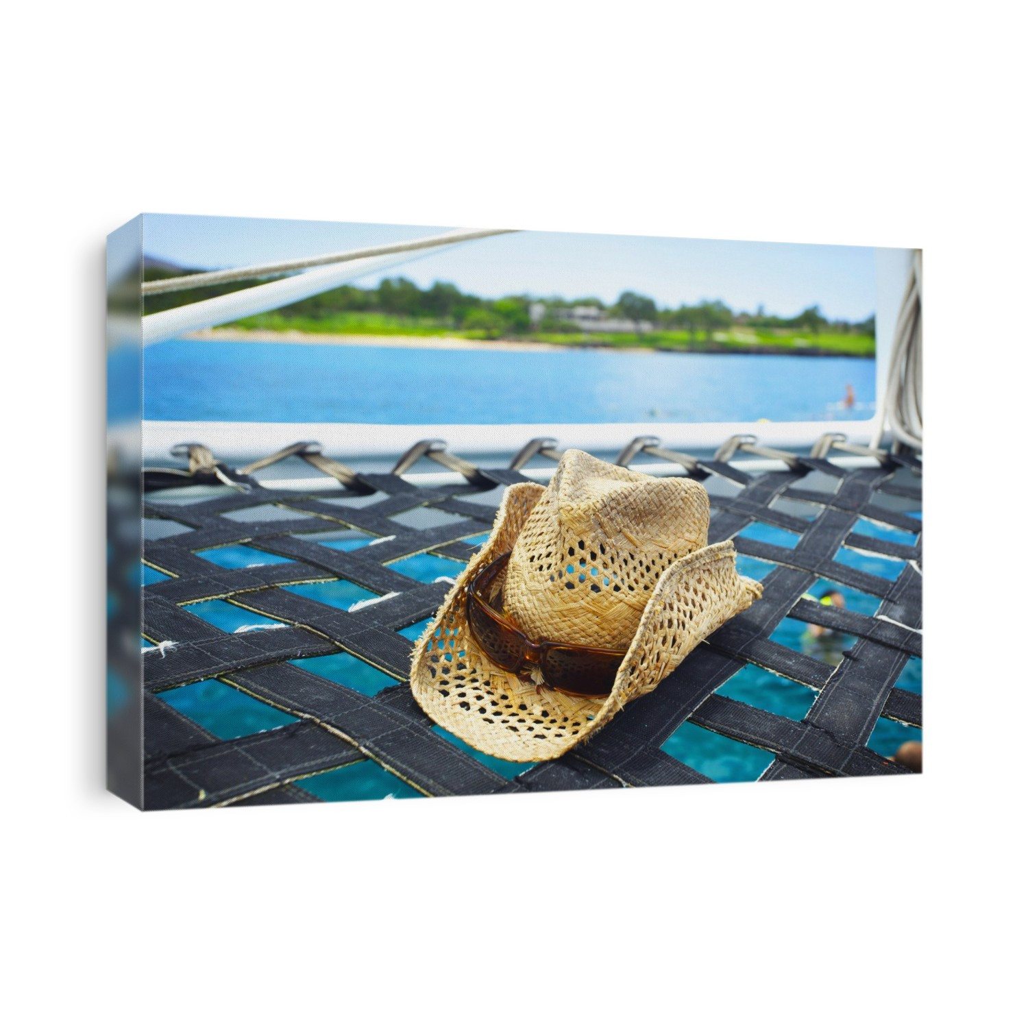 A Sunhat On The Hammock Of A Catamaran Off The Coast Of An Hawaiian Island; Hawaii, United States Of America
