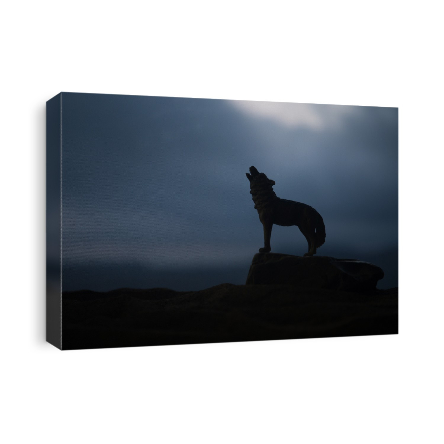 Silhouette of howling wolf against dark toned foggy background. Halloween horror concept. Artwork decoration. Selective focus