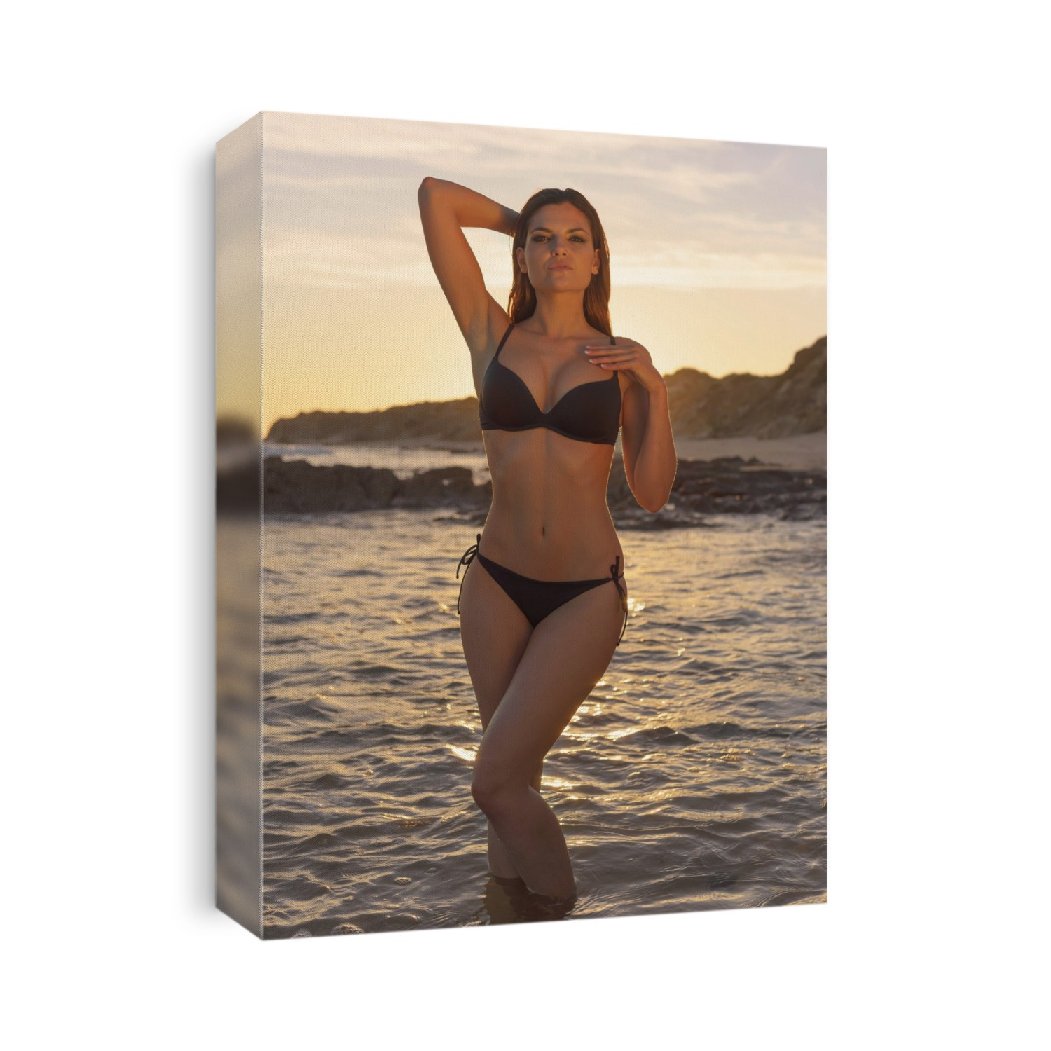 Woman In Black Bikini Standing In The Shallow Water At The Coast At Sunset; Tarifa, Cadiz, Andalusia, Spain