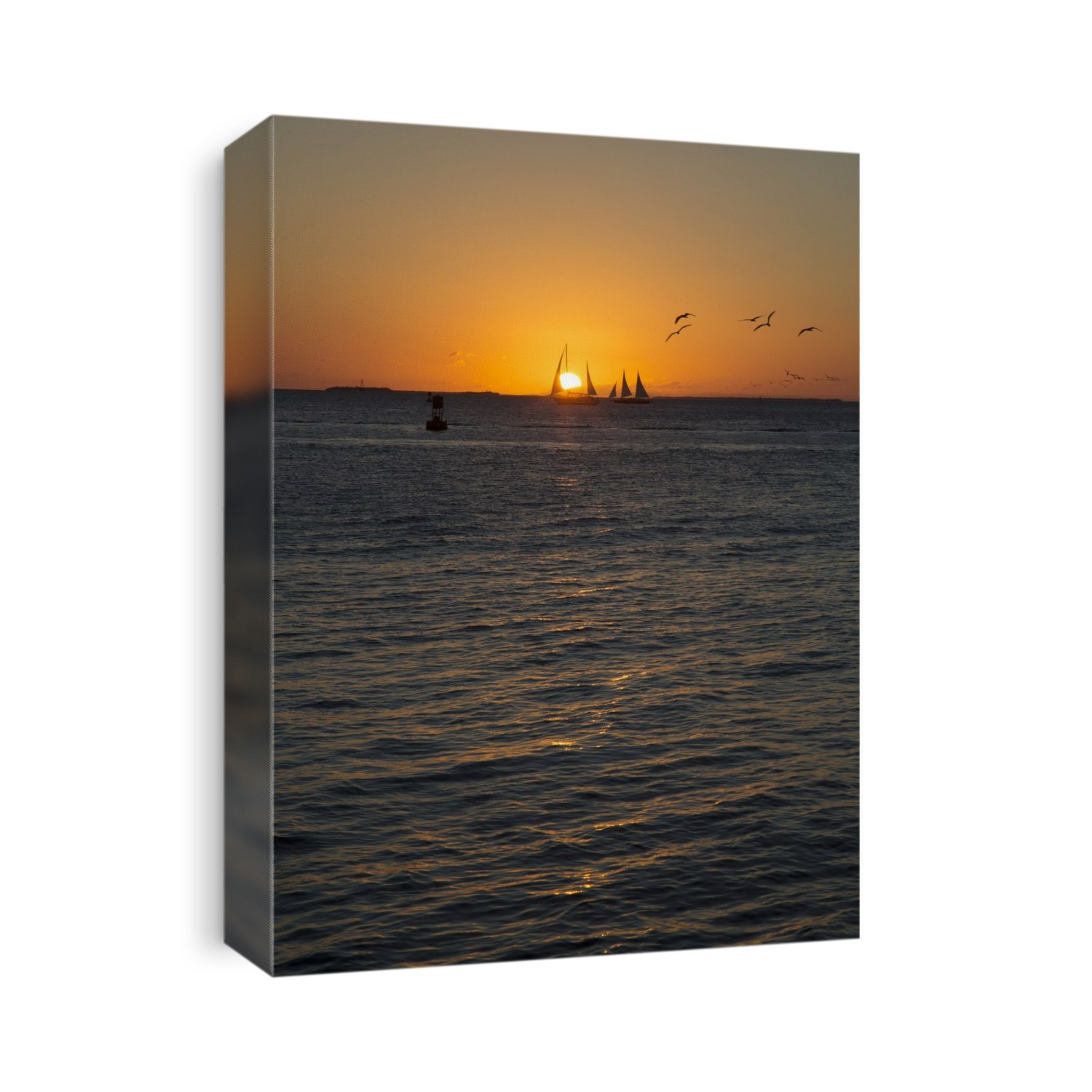 Sailing boats at sunset. Photographed at Key West, Florida, USA.