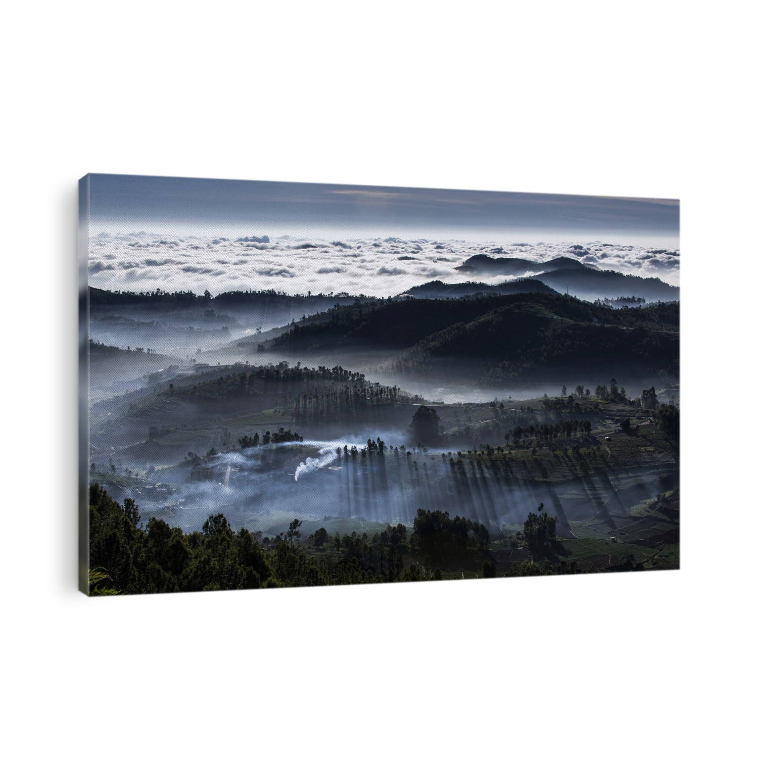 Mist-shrouded mountain valleys. Aerial view over mountains and valleys shrouded in mist and clouds. Photographed in India.
