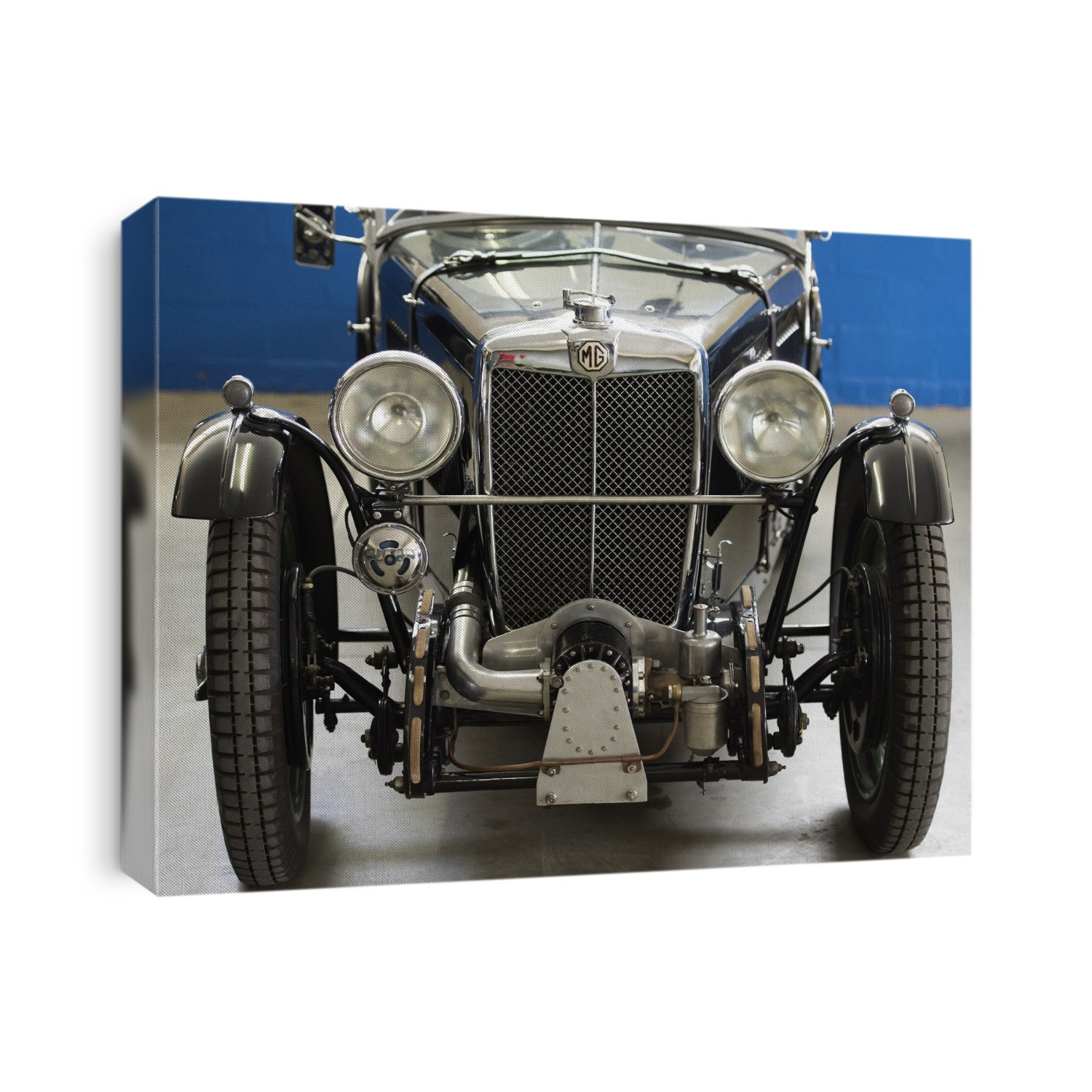 The MG T series (TA to TF) was a British sports car produced between 1936 and 1955. The TC was the first postwar MG, launched in 1945. This vehicle was fitted with a 1, 250 cc pushrod-OHV engine and a supercharger which enabled it to produce around 70 BHP.