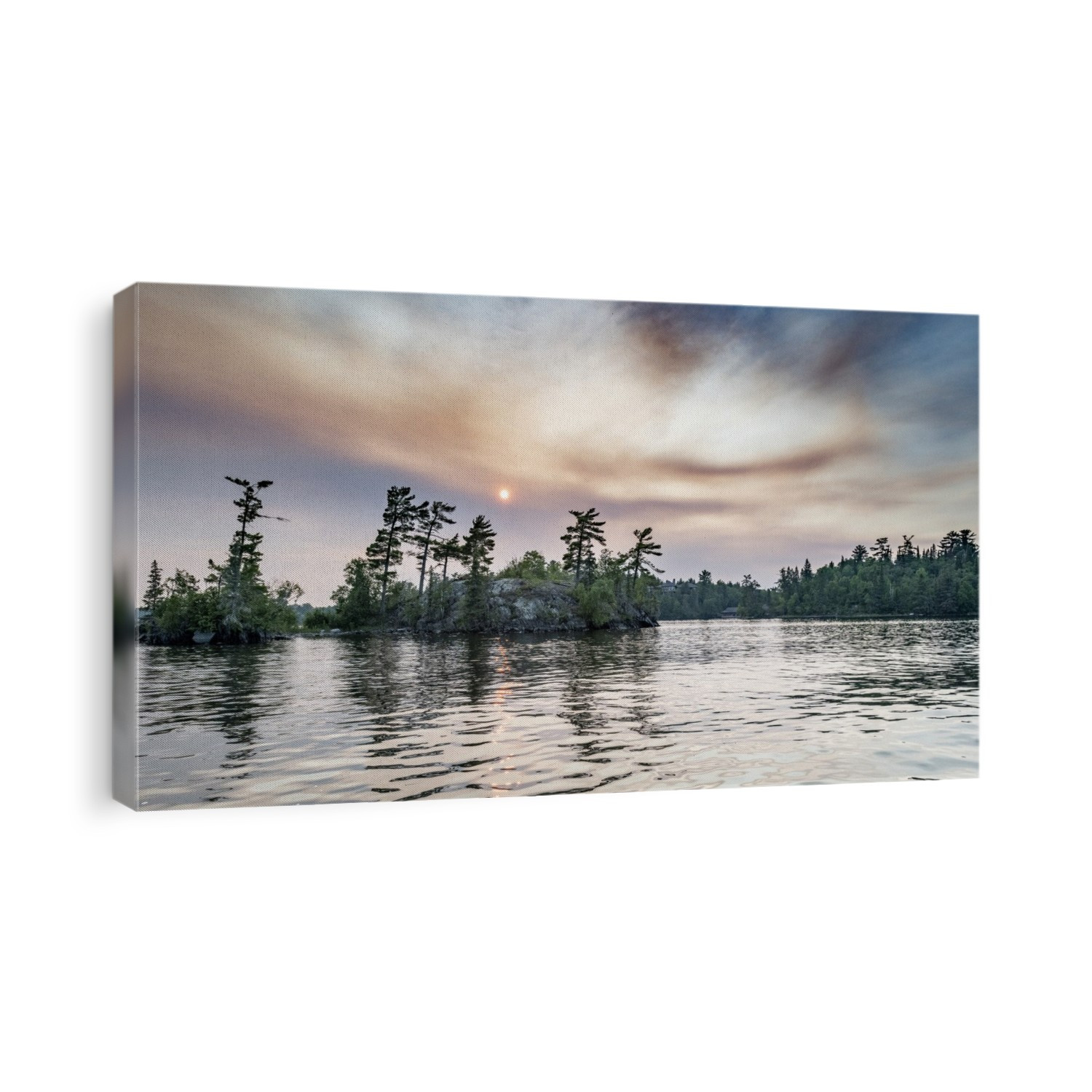 Sun glowing in clouds over a lake and forest at sunset, Lake of the Woods, Ontario; Kenora, Ontario, Canada