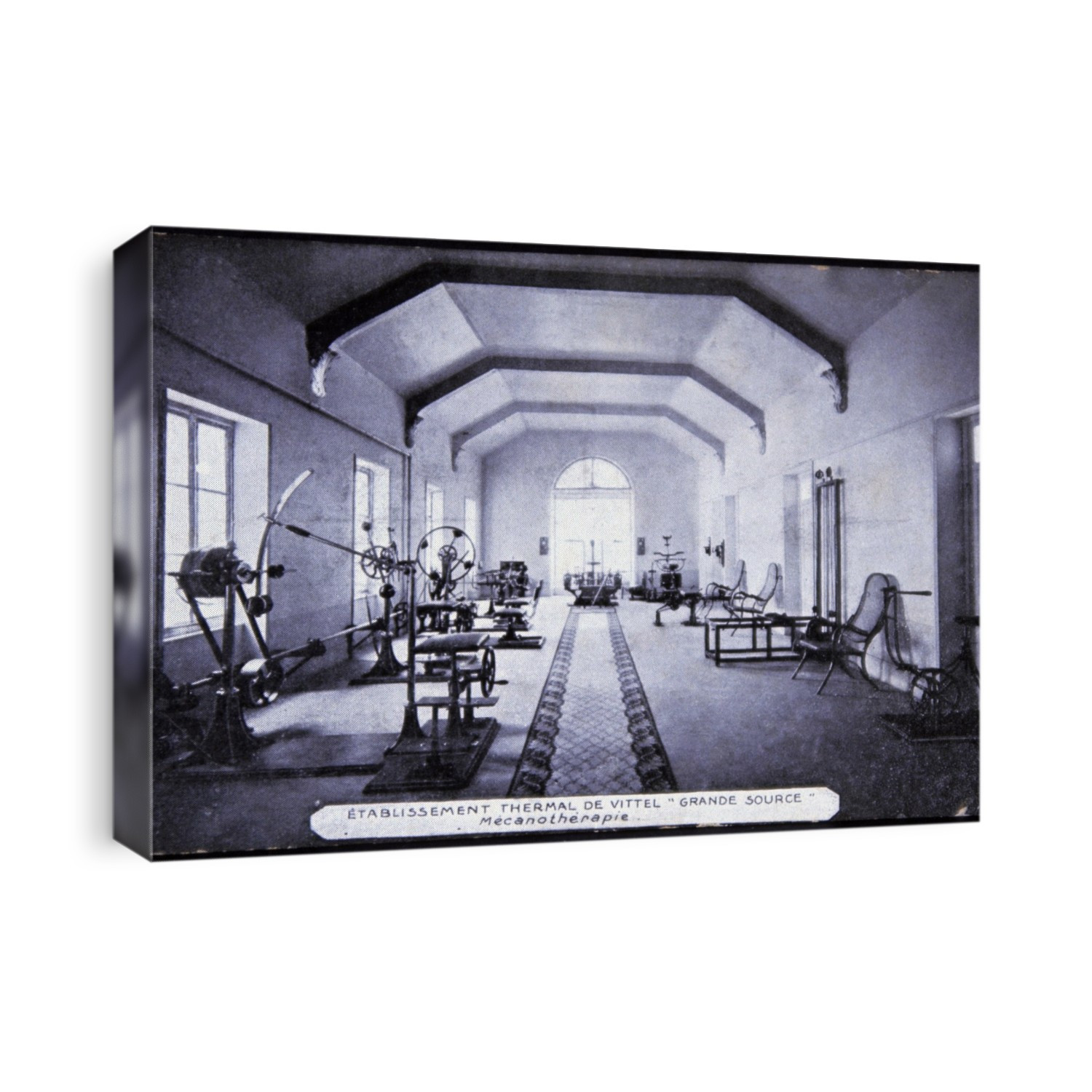 Exercise room at a spa. Early 20th century postcard of an exercise room at the Grande Source at the thermal spa town of Vittel, France. The history of Vittel dates back to 1854 when the spring was discovered by a French doctor, Louis Bouloumie. A mineral water and spa industry grew up in the town, with people travelling there to 'take the waters' to improve their health. In the early 21st century, Vittel remains a spa town, and the Vittel brand of mineral water is famous worldwide. The postcard dates from around 1910.