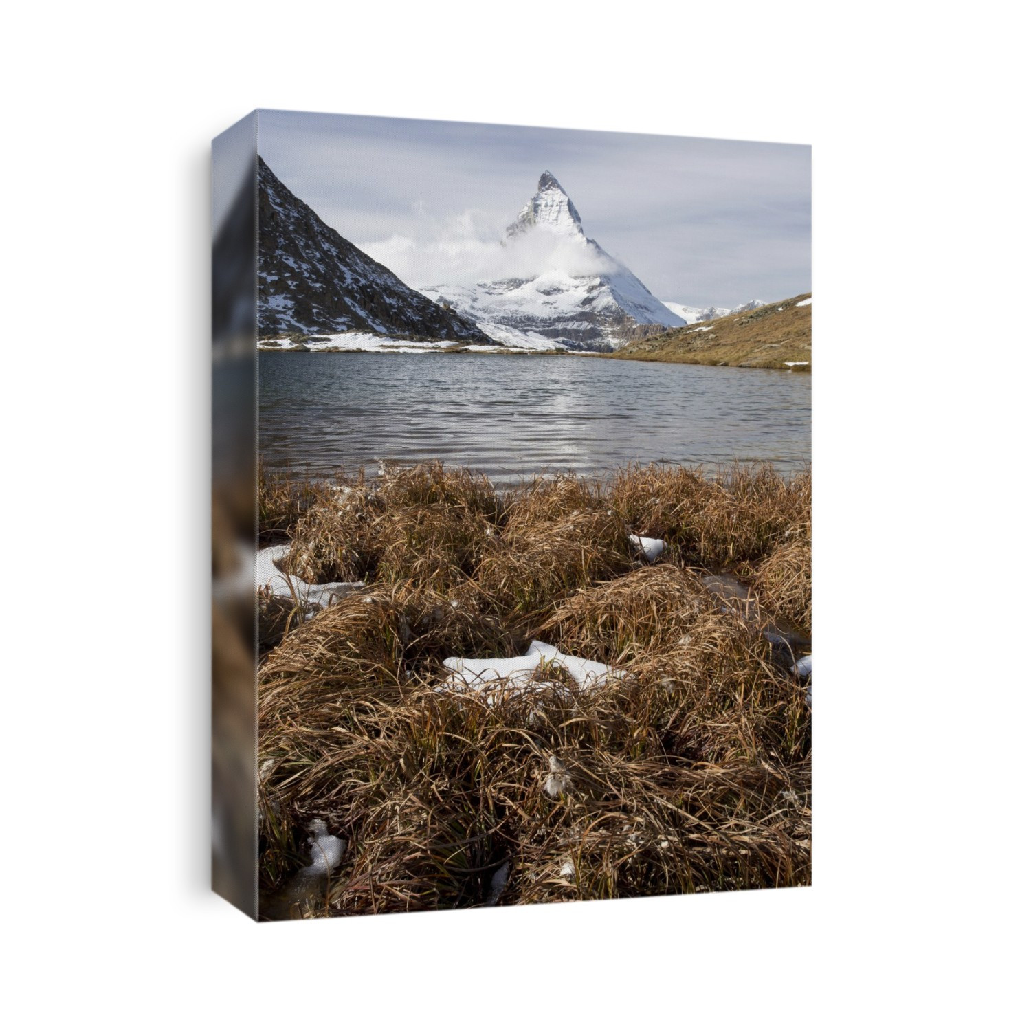 Matterhorn from Switzerland. View across the Riffelsee lake, Switzerland, towards the Matterhorn (upper centre), in autumn. The Matterhorn, or Monte Cervino is located in the Alps on the border of Switzerland and Italy. It measures 4,478 metres above sea level.