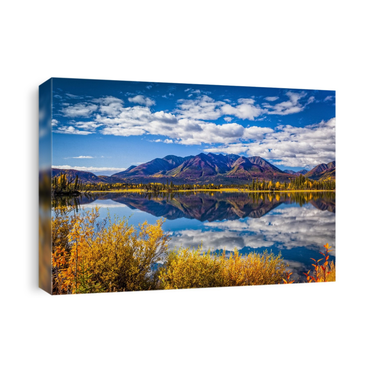 Mountain range reflects on Mentasta Lake with fall coloured foliage under blue sky, Tok cutoff from the Glenn Highway, South-central Alaska in autumn; Alaska, United States of America