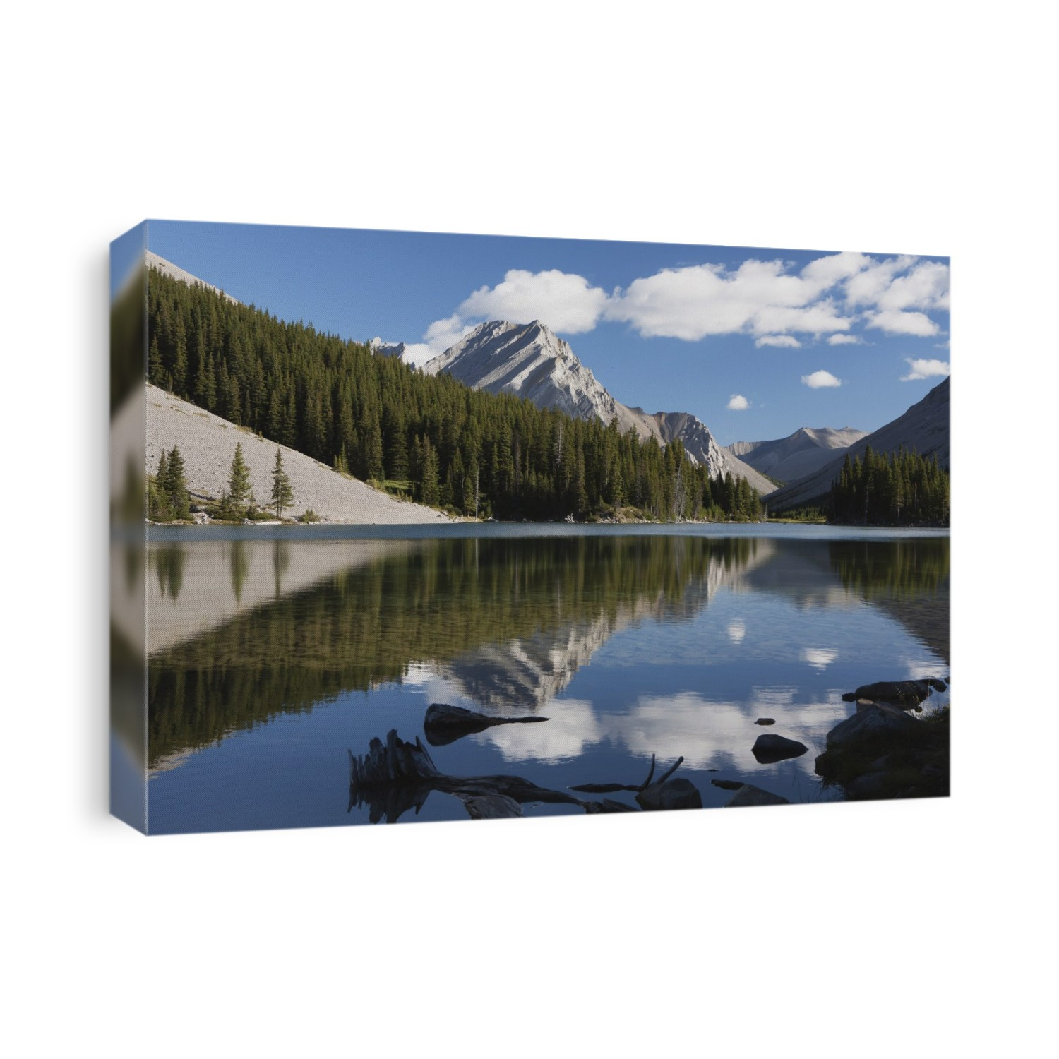 Mountain reflecting in lake with blue sky and clouds in kananaskis provincial park; Alberta canada