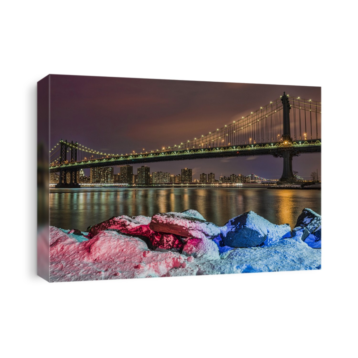 Manhattan Bridge By Snow-Covered Rocks At Sunset, Brooklyn Bridge Park; Brooklyn, New York, United States Of America
