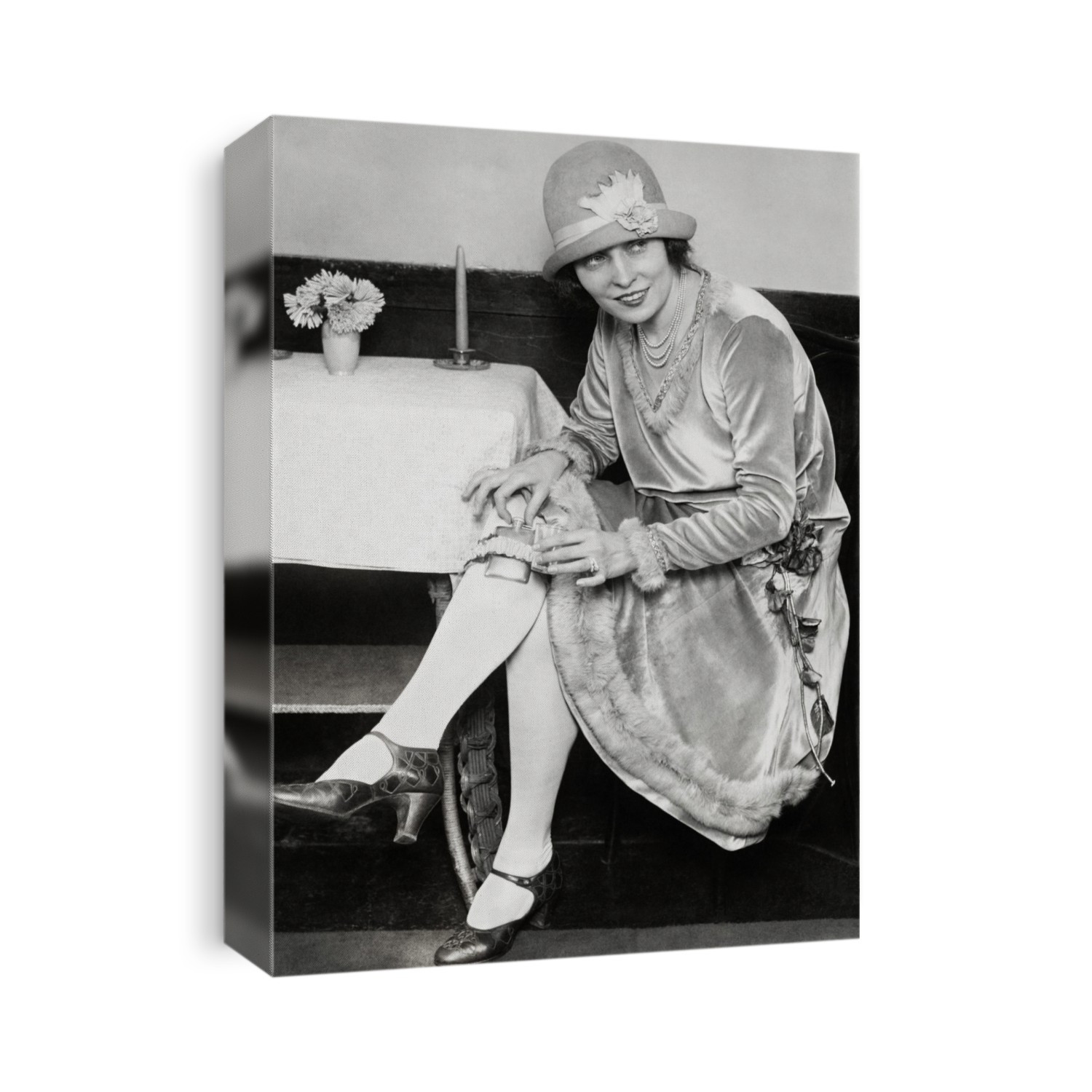 Garter flask. Dancer demonstrating the latest fashion for the use of a concealed garter flask for carrying alcoholic drinks during prohibition in the USA. This flask, similar to a hip flask, is held in place by a garter, a band of fabric used to prevent a stocking falling down. Prohibition in the USA (1920-1933) was the period when the sale and purchase of alcoholic drinks was banned. Photographed on 26 January 1926, in Washington DC, USA.