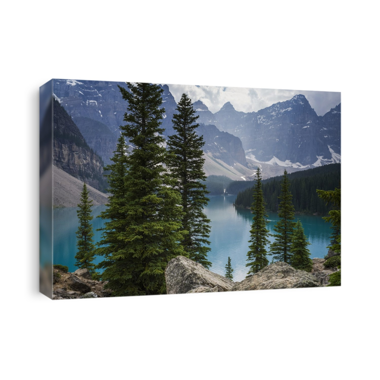 Stunning view of the rugged Canadian rocky mountain peaks and a tranquil turquoise Moraine Lake with forests along the shoreline; Field, British Columbia, Canada