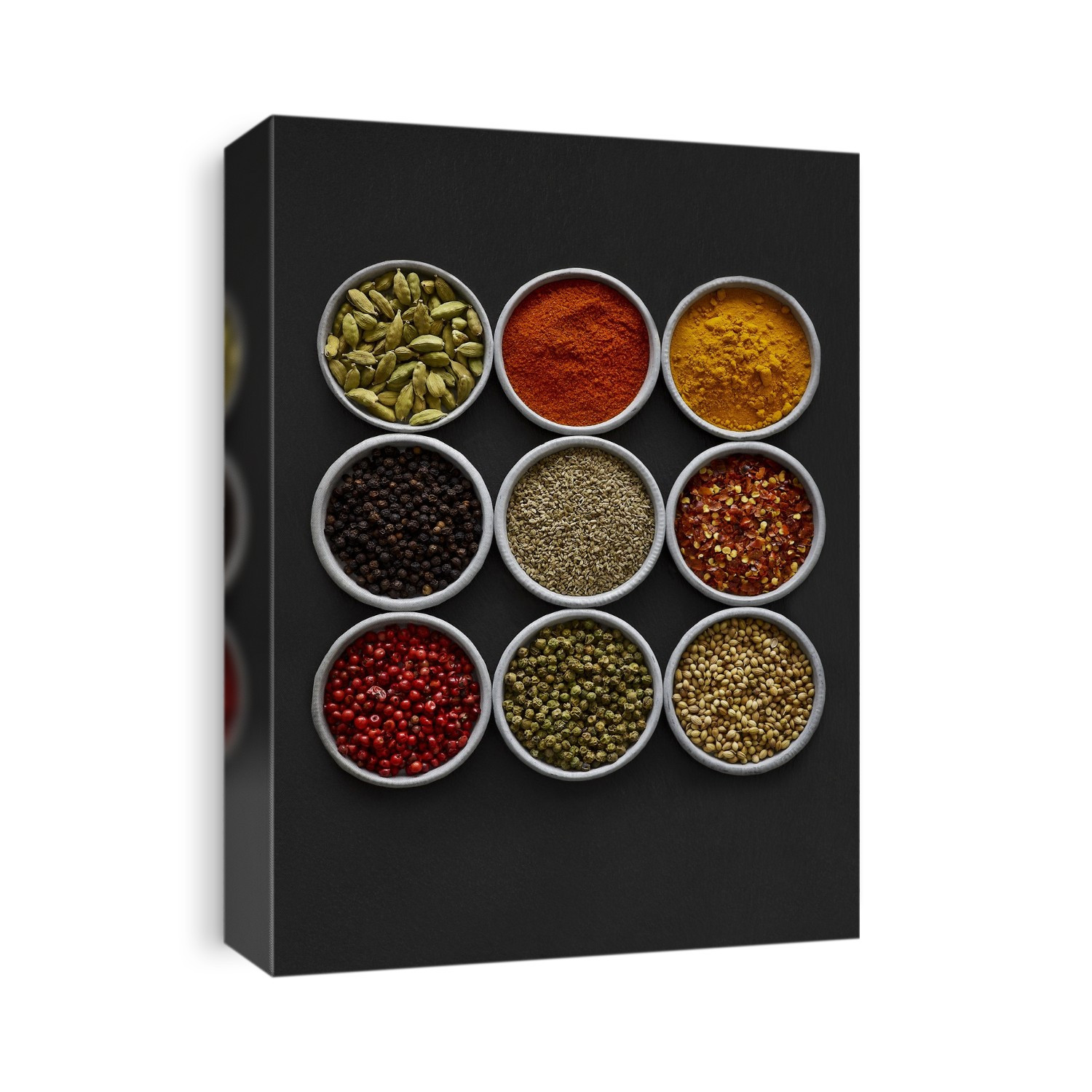Dried spices in small bowls, overhead view.