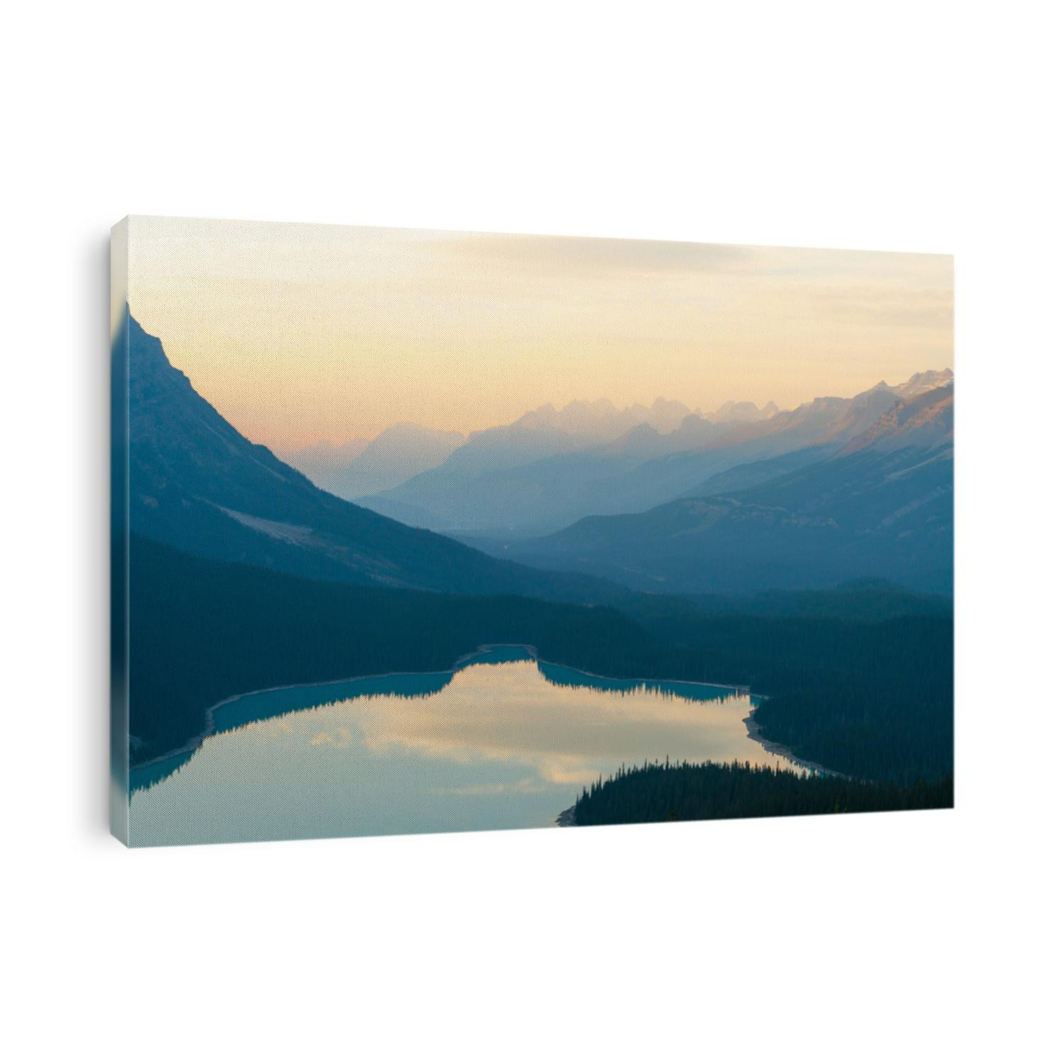 The orange glow of sunset over Peyto Lake in Banff National Park close up
