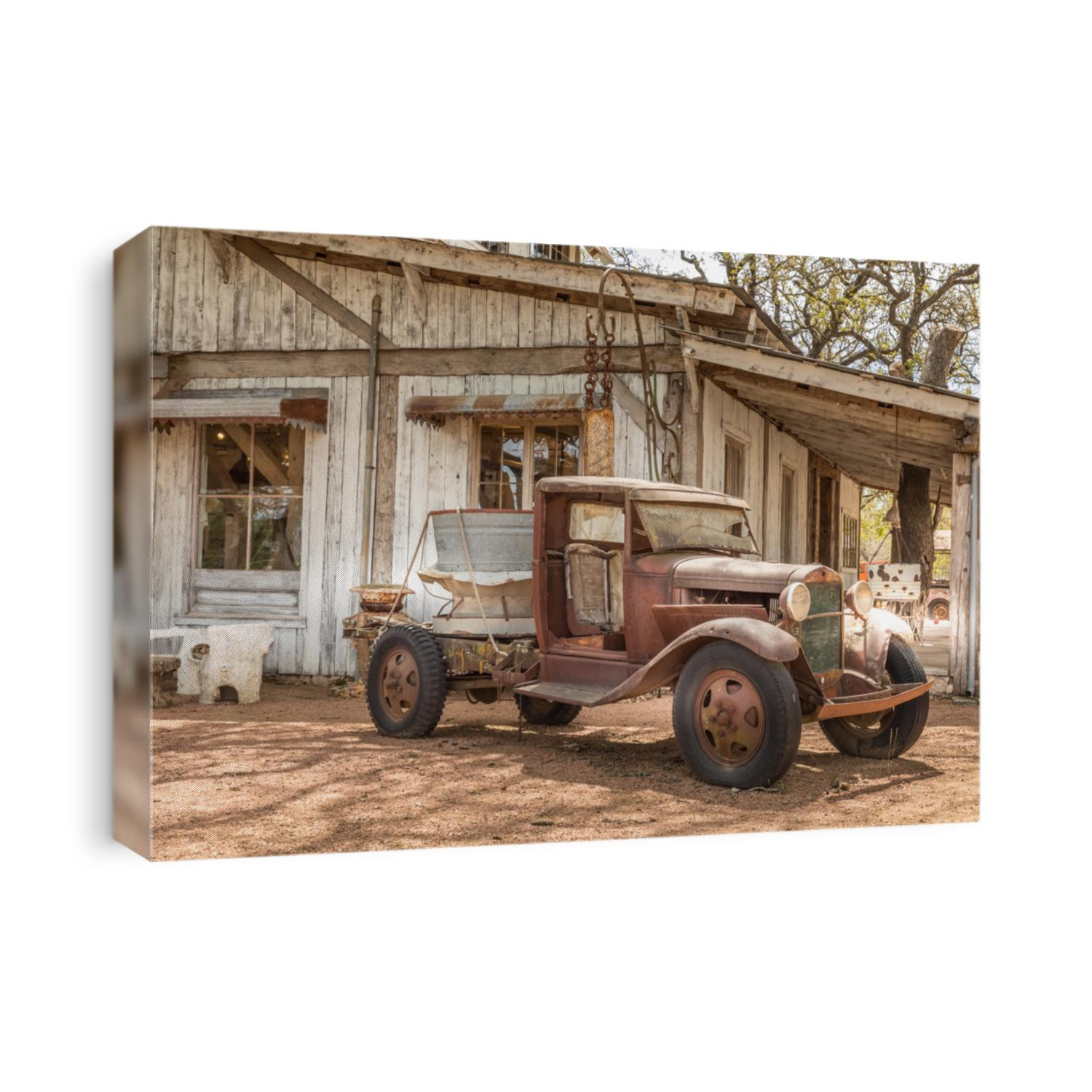 Old rusty truck and an old abandoned barn