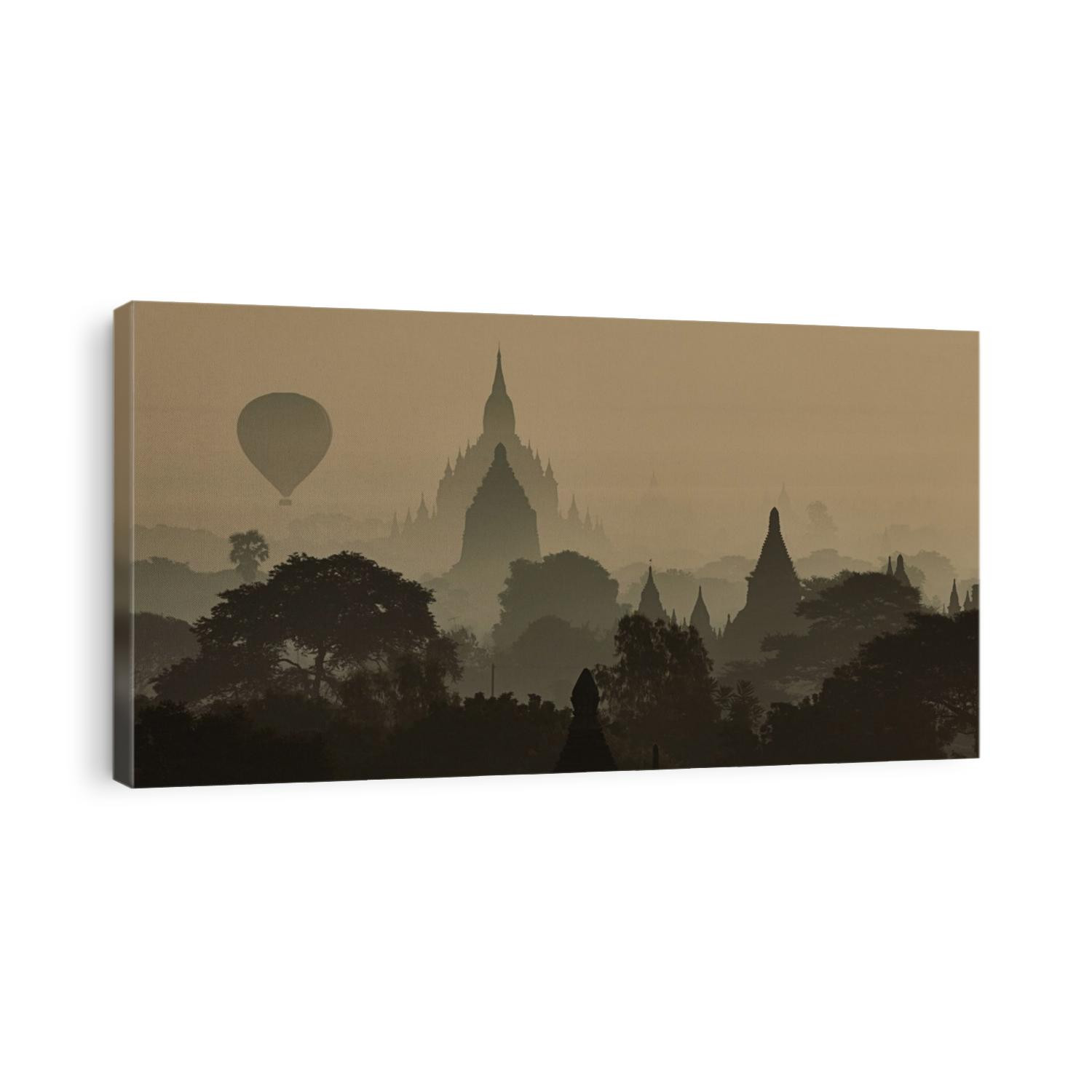 Hot air balloons floating above the temples of Bagan, Myanmar at sunrise