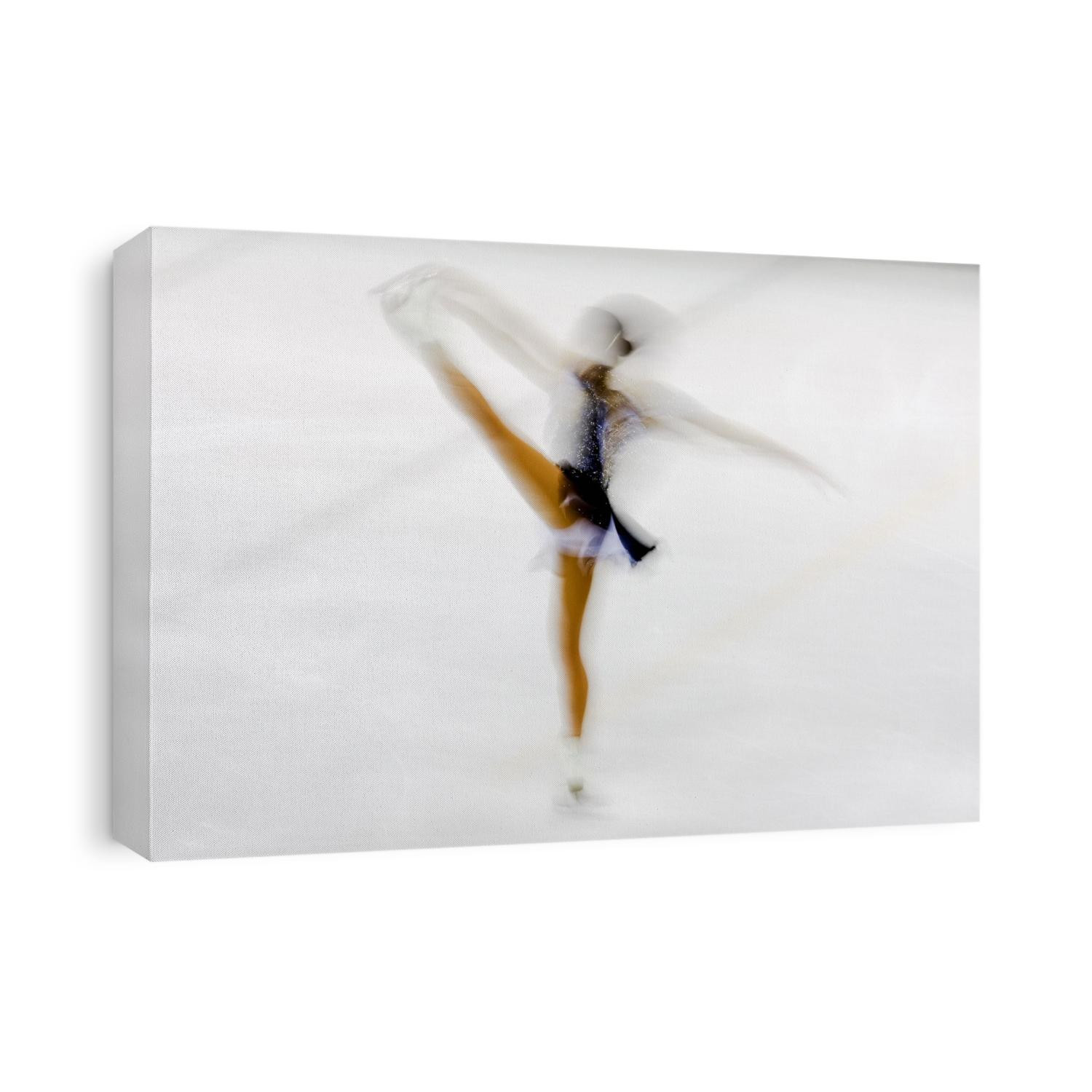 Blurred action of woman figure skater.