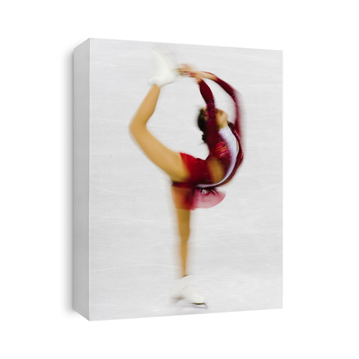 Blurred action of woman figure skater.