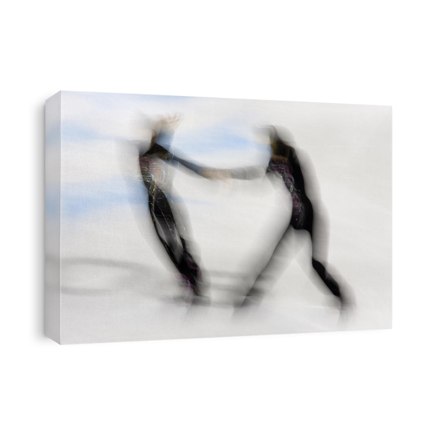 Blurred action of pairs figure skaters.