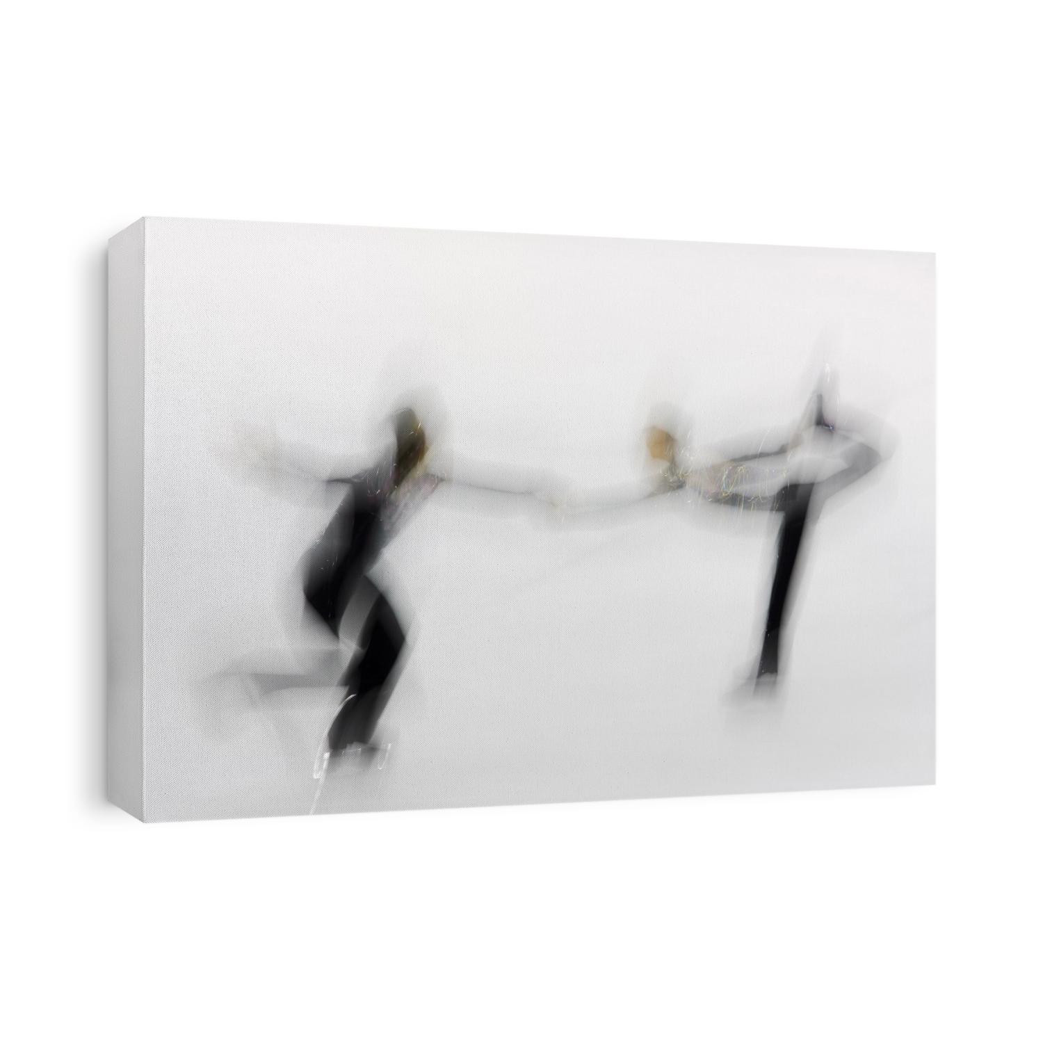 Blurred action of pairs figure skaters.
