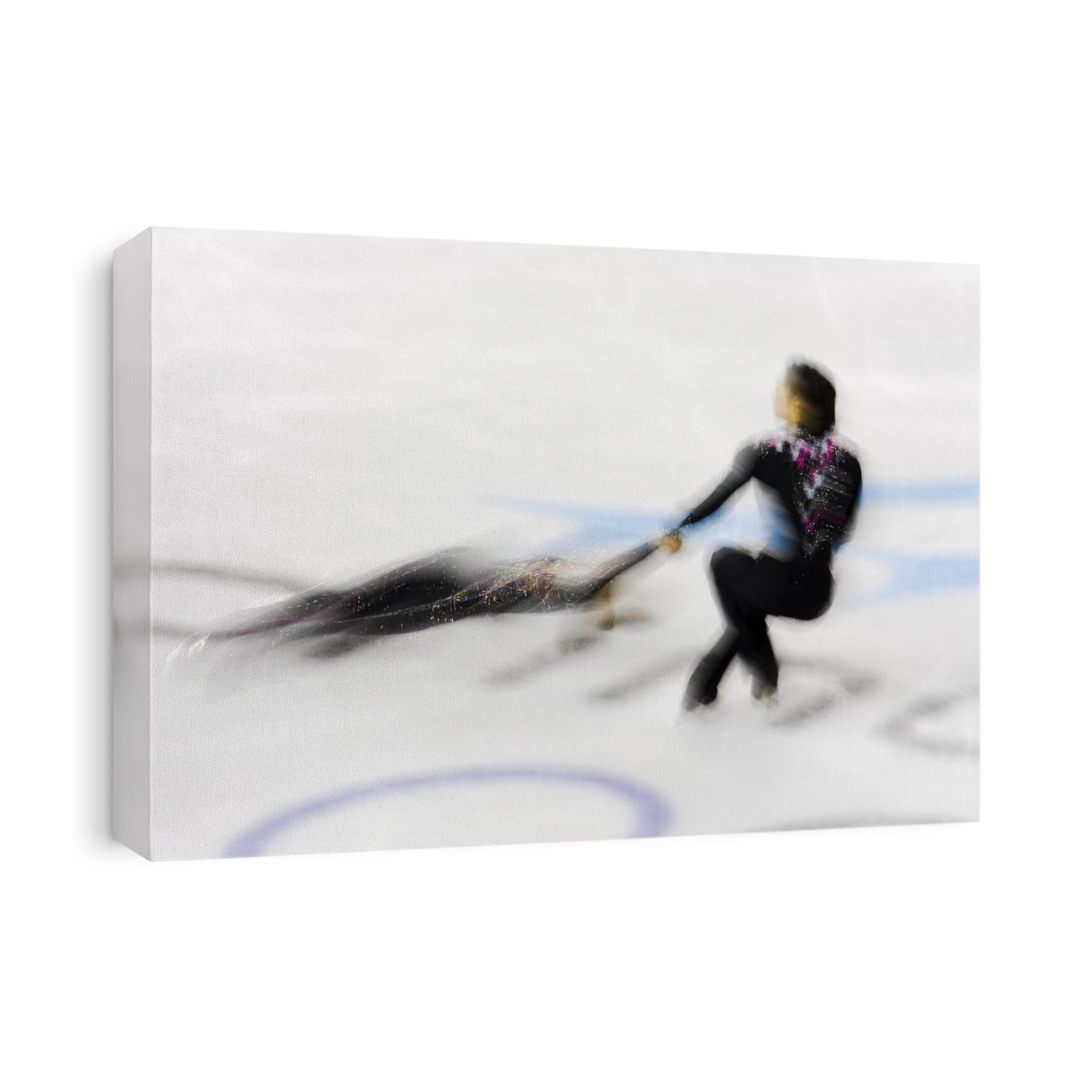 Blurred action of pairs figure skaters.