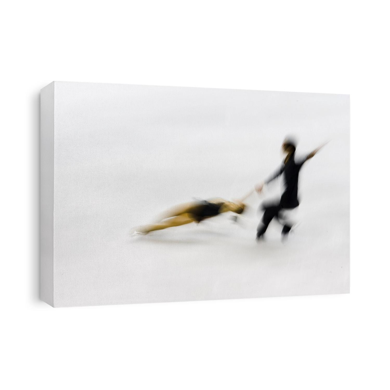 Blurred action of pairs figure skaters.