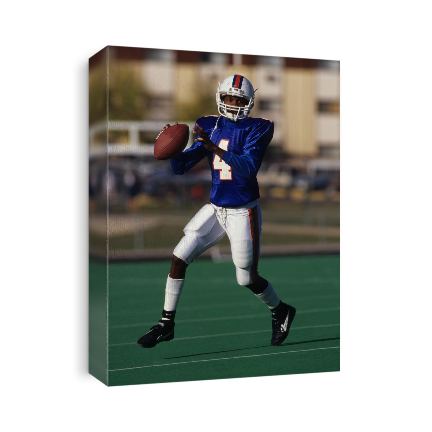 Football quarterback in action.
