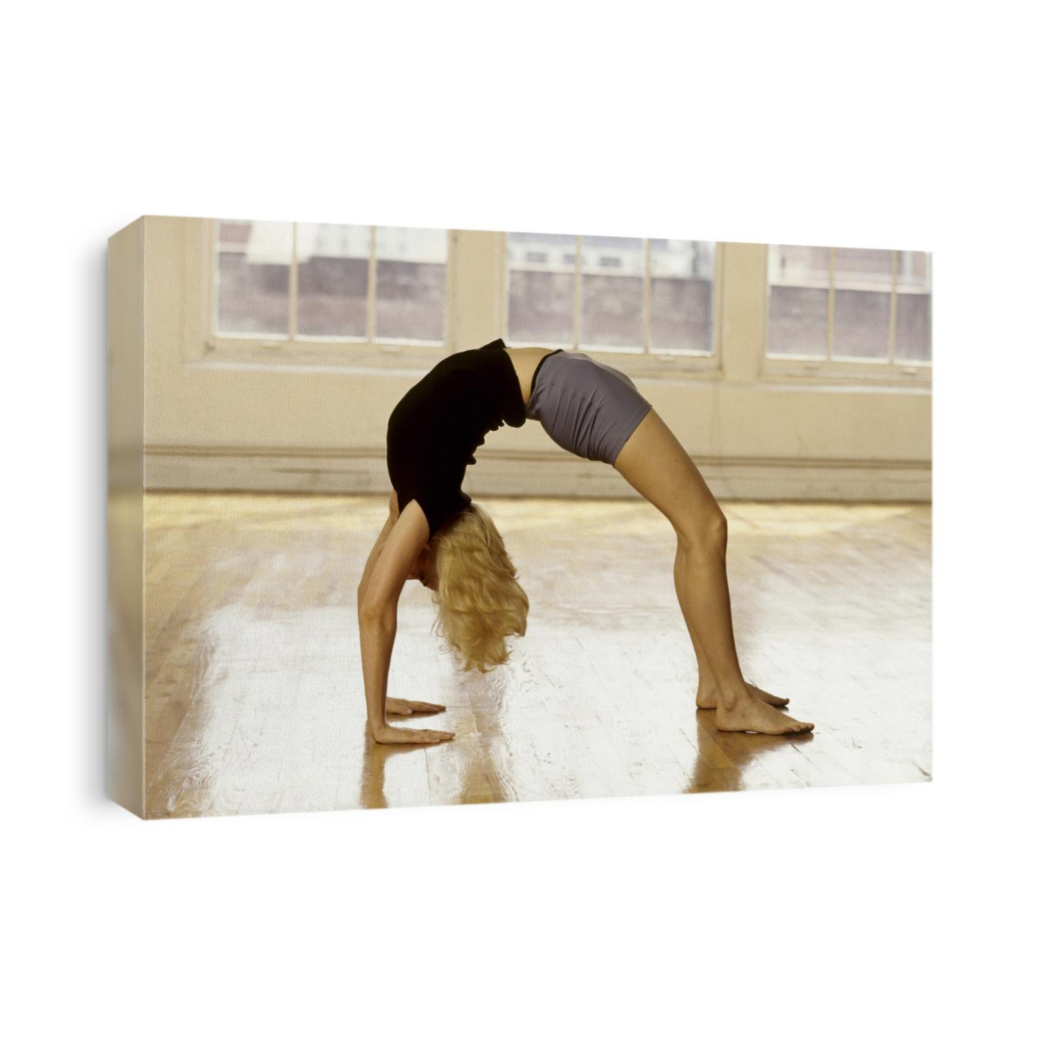 Young woman in yoga position.