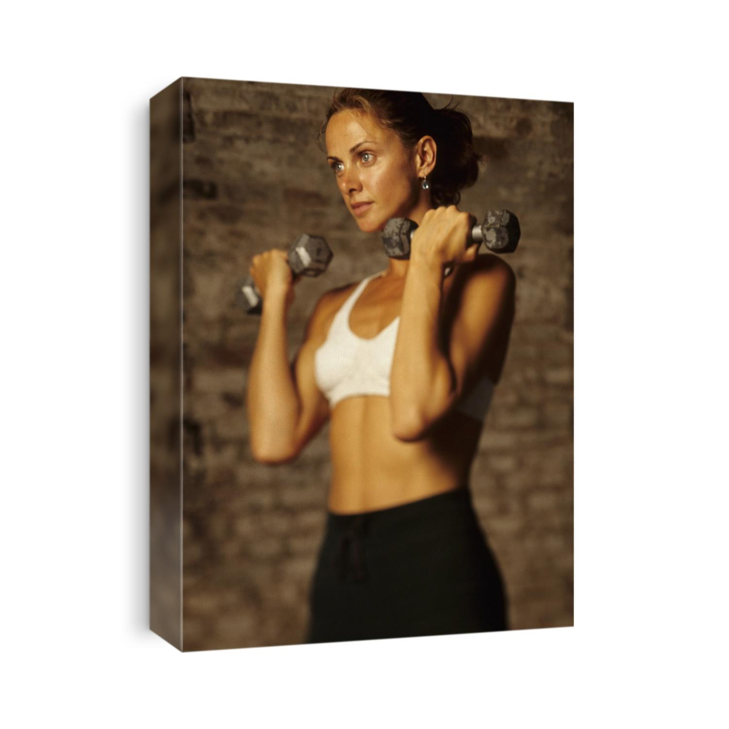 Women working out with hand wieghts.
