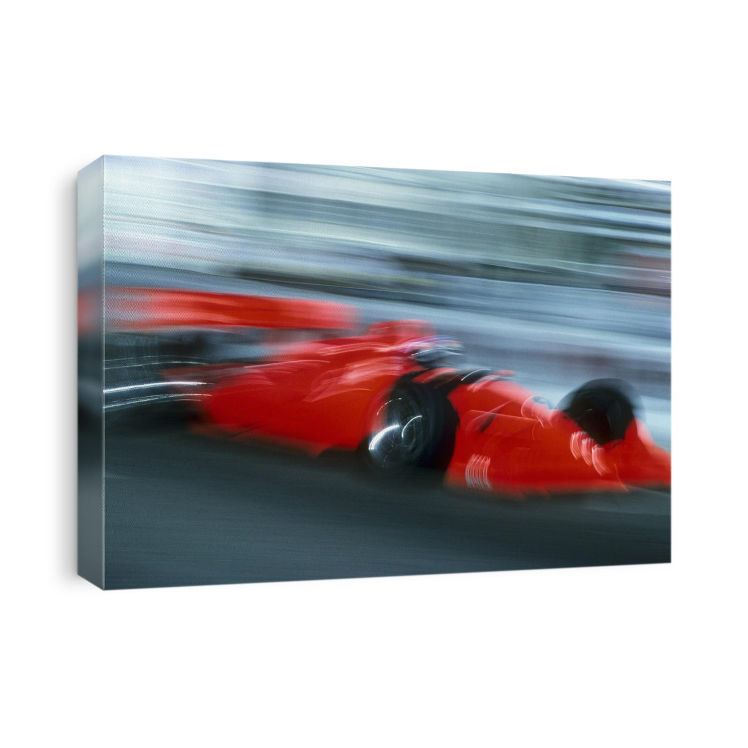 Blurred auto racing action.