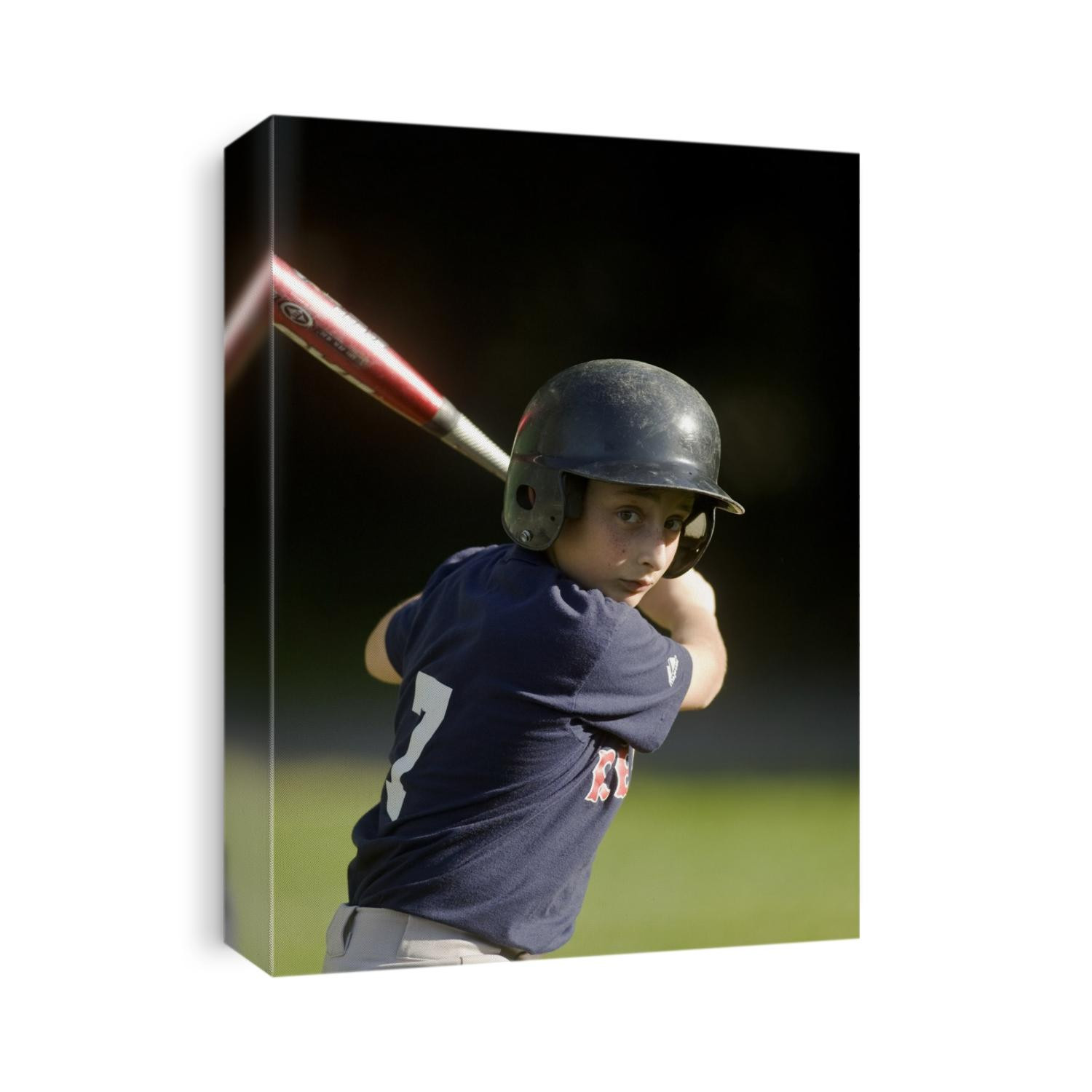 10 year old boy batting during baseball game.