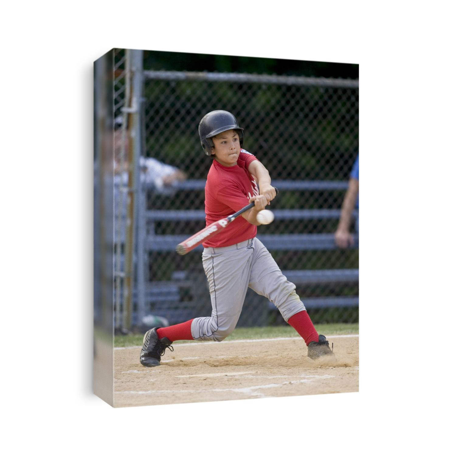 Boys baseball game action.