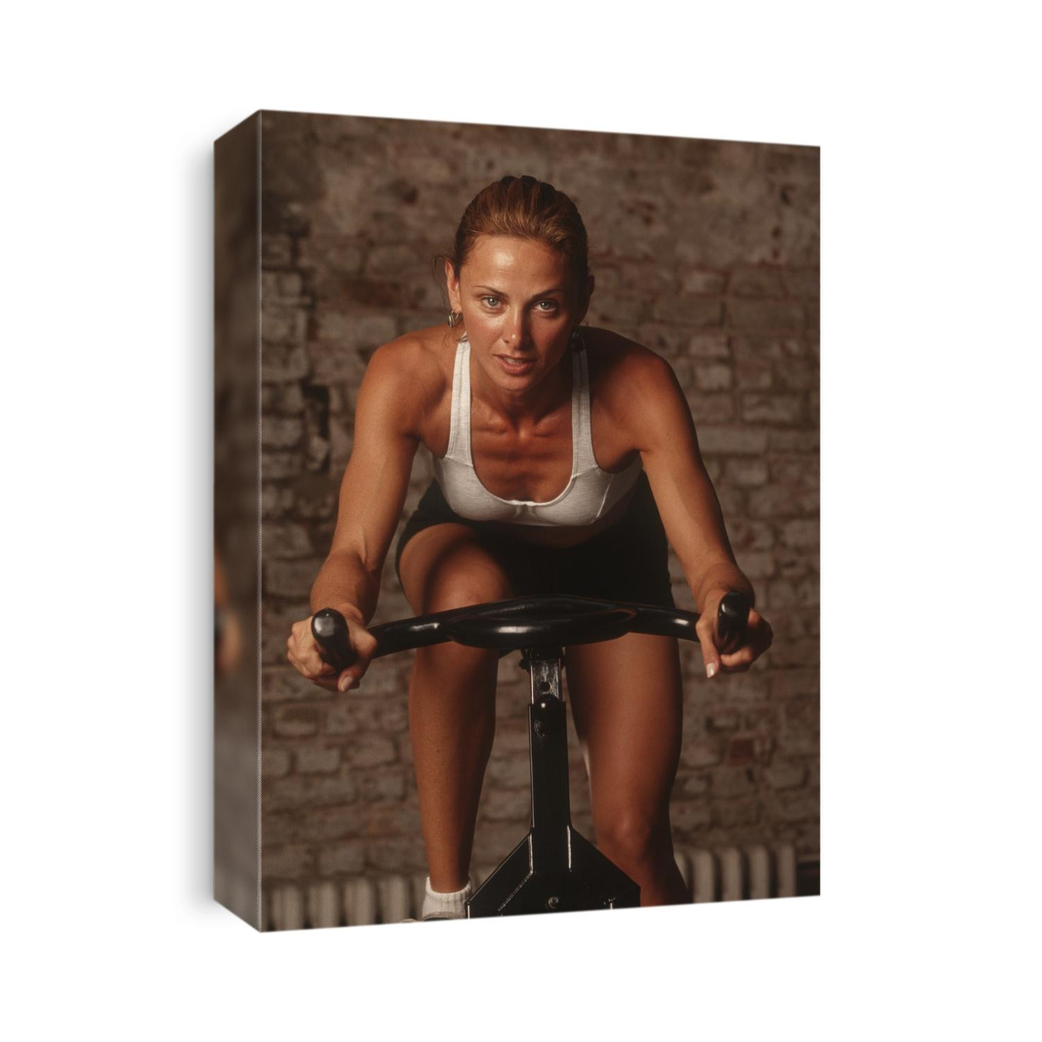 Woman exercising on a stationary bike.