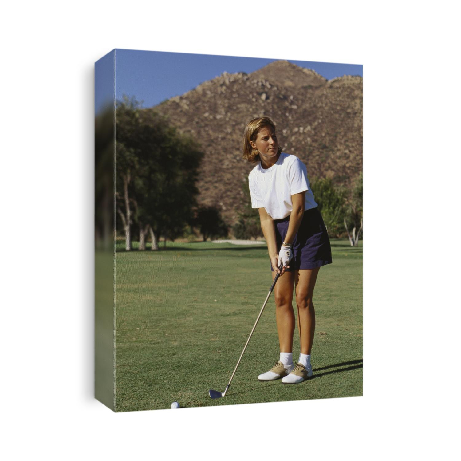 Woman golfer in action.