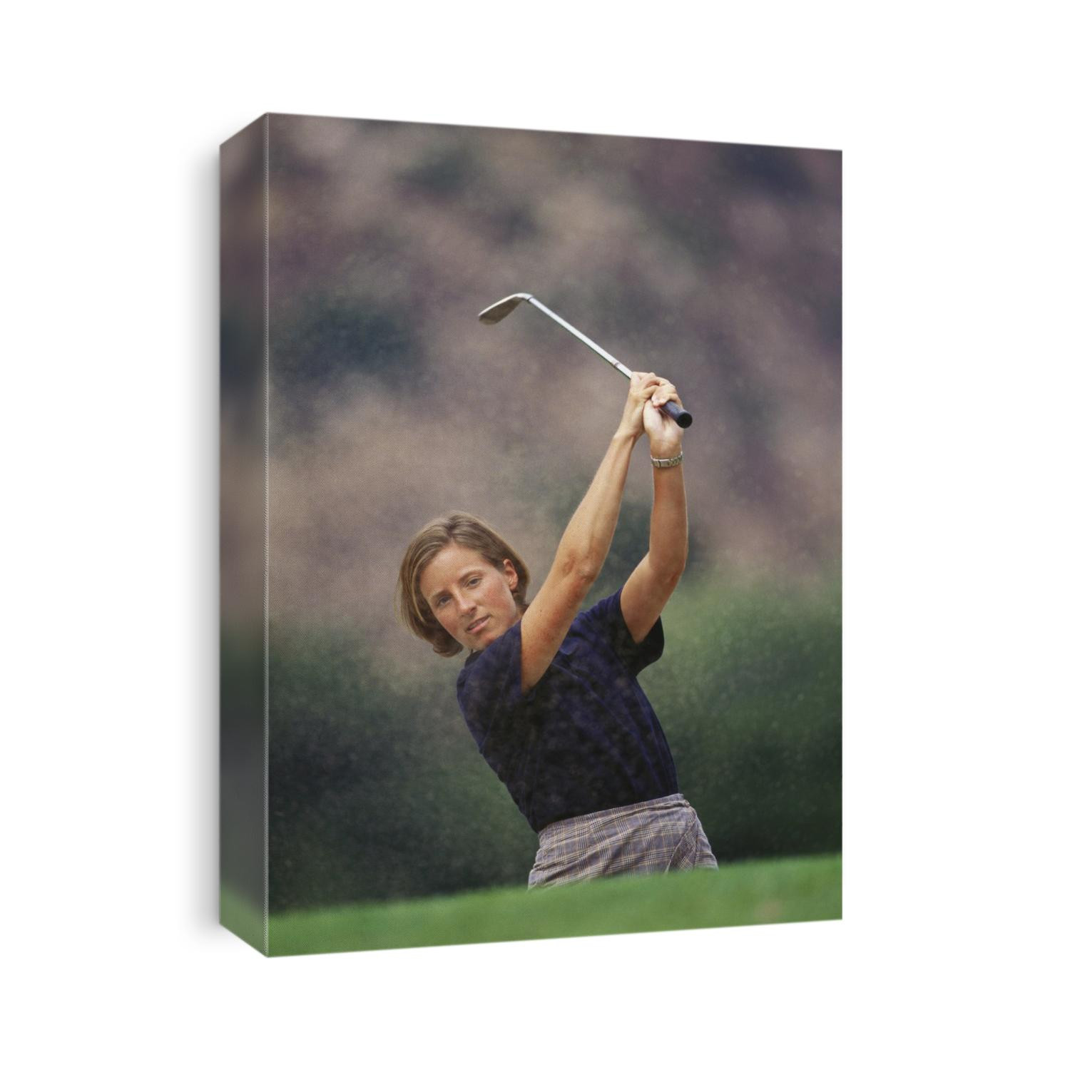 Woman golfer in action.