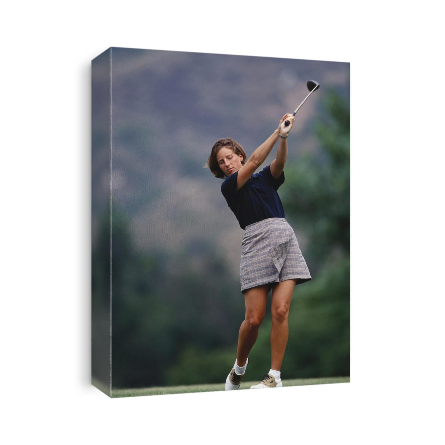 Woman golfer in action.