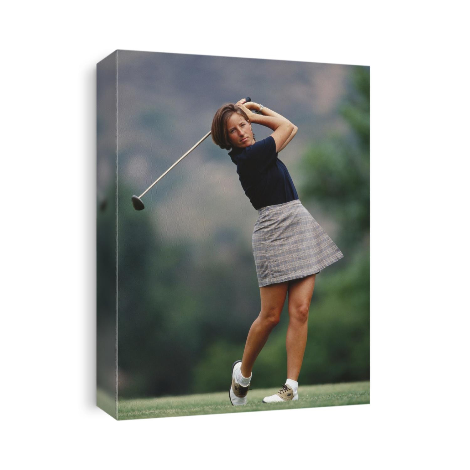Woman golfer in action.
