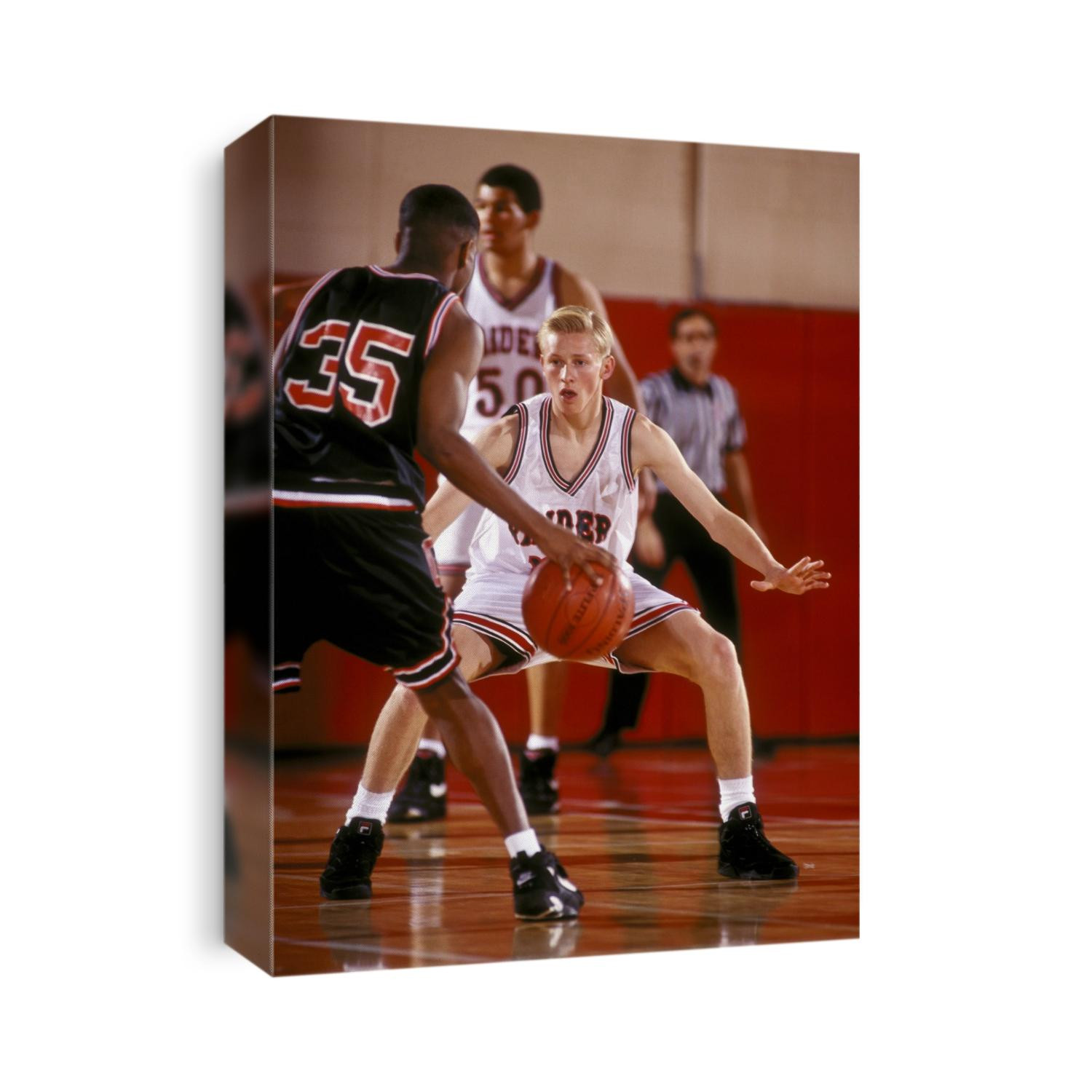 Boys High School basketball players during a game.