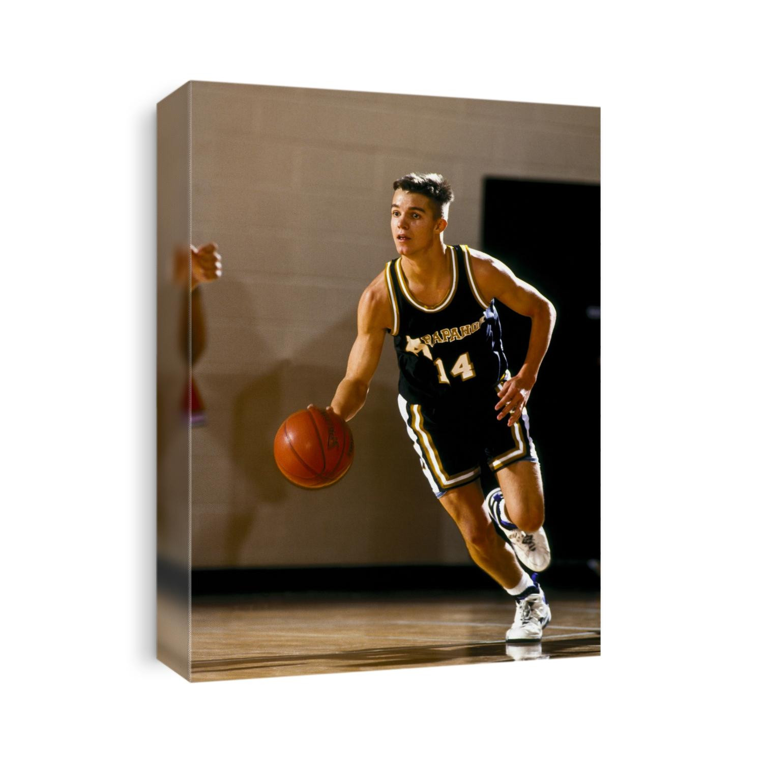 Boys High School basketball player during a game.