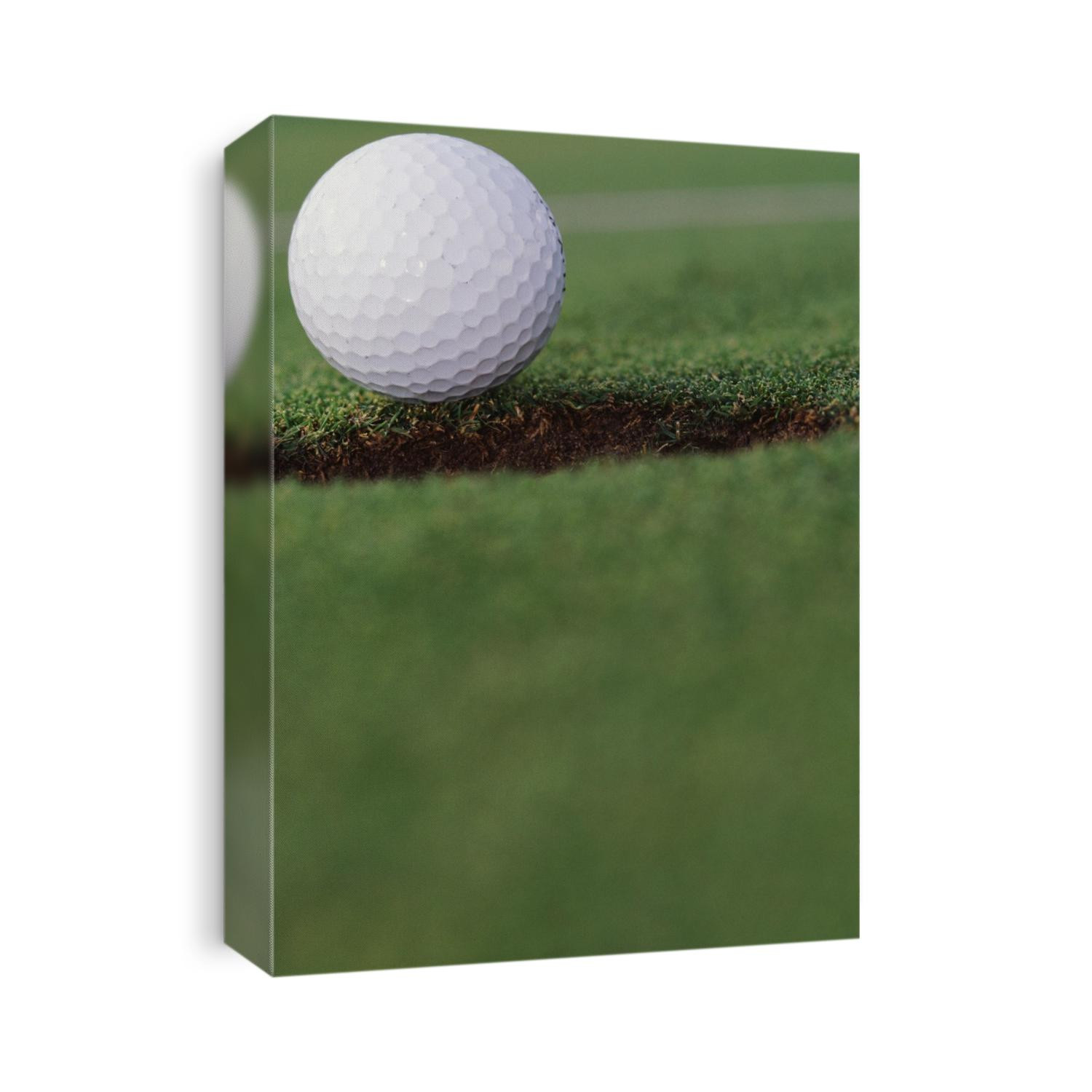 Golf ball at the hole.