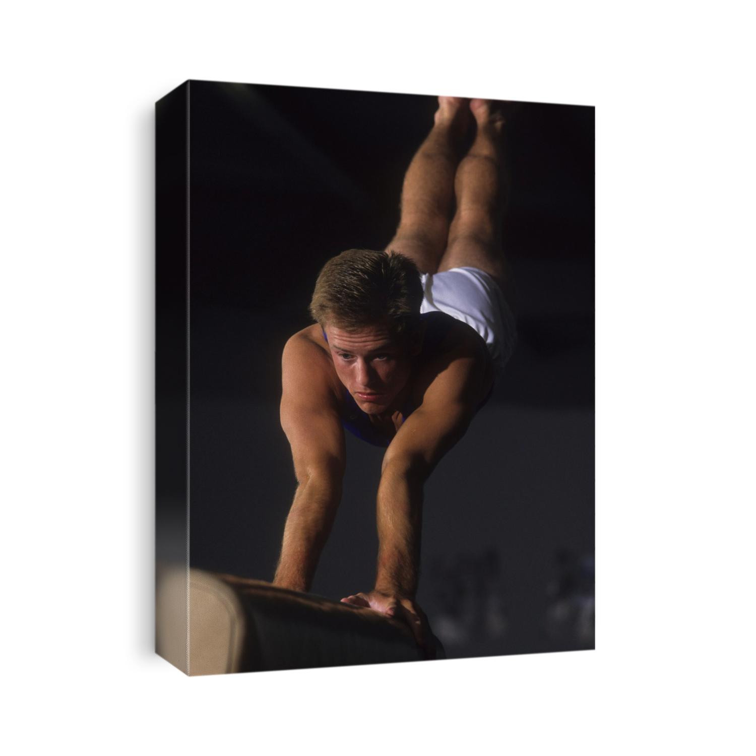 Male gymnast on the vault.